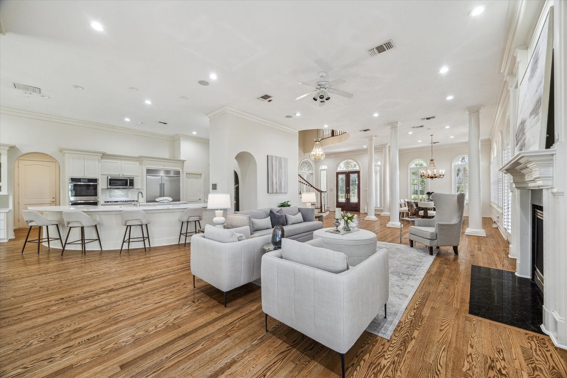 38 Scotsmoor Court, Sugar Land, TX 77479 Livingroom with solid oak flooring and loads of light