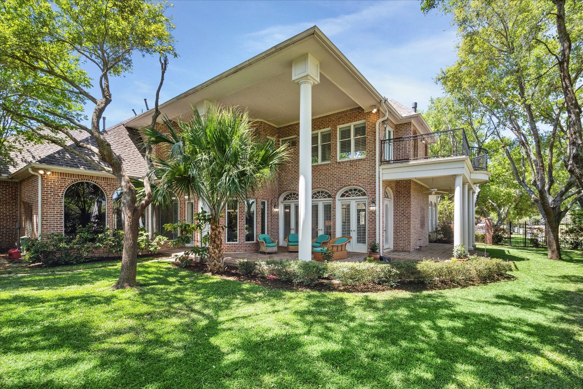 38 Scotsmoor Court, Sugar Land, TX 77479 Looking back at the rear and side elevation of this gorgeously appointed home from the back yard.