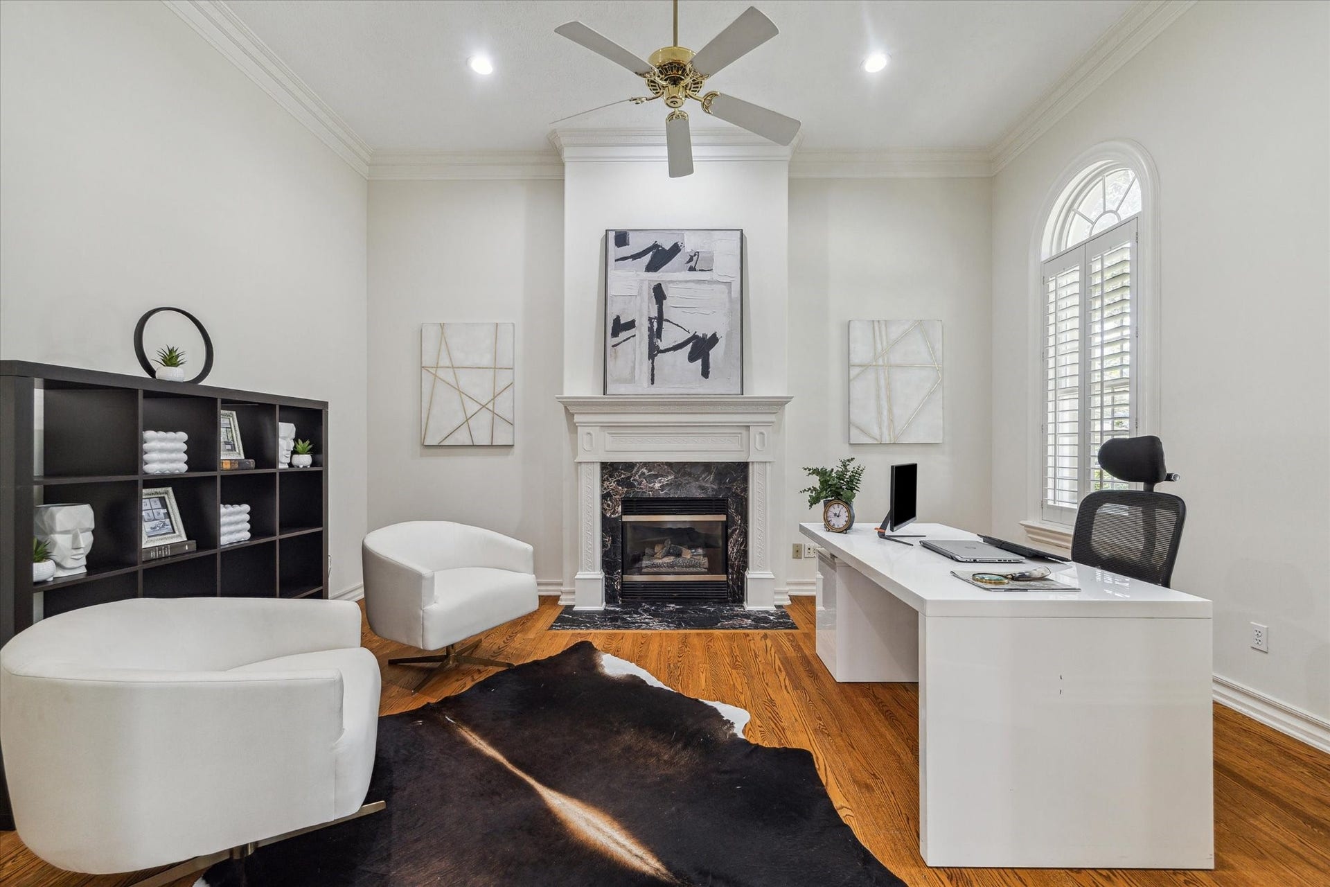 38 Scotsmoor Court, Sugar Land, TX 77479 Private study with high ceilings and gas fireplace behind glass doors to the right of the entry.