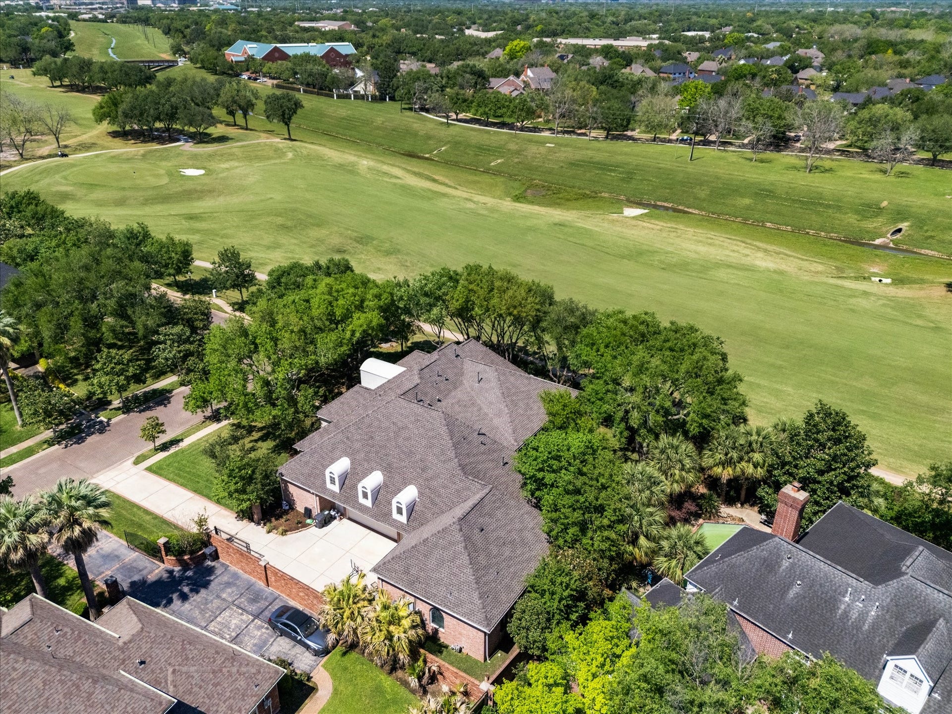 38 Scotsmoor Court, Sugar Land, TX 77479 This aeriel view shows the golf course and the full orientation of the home on the cul-de-sac with it's densely wooded fully fenced lot and driveway.