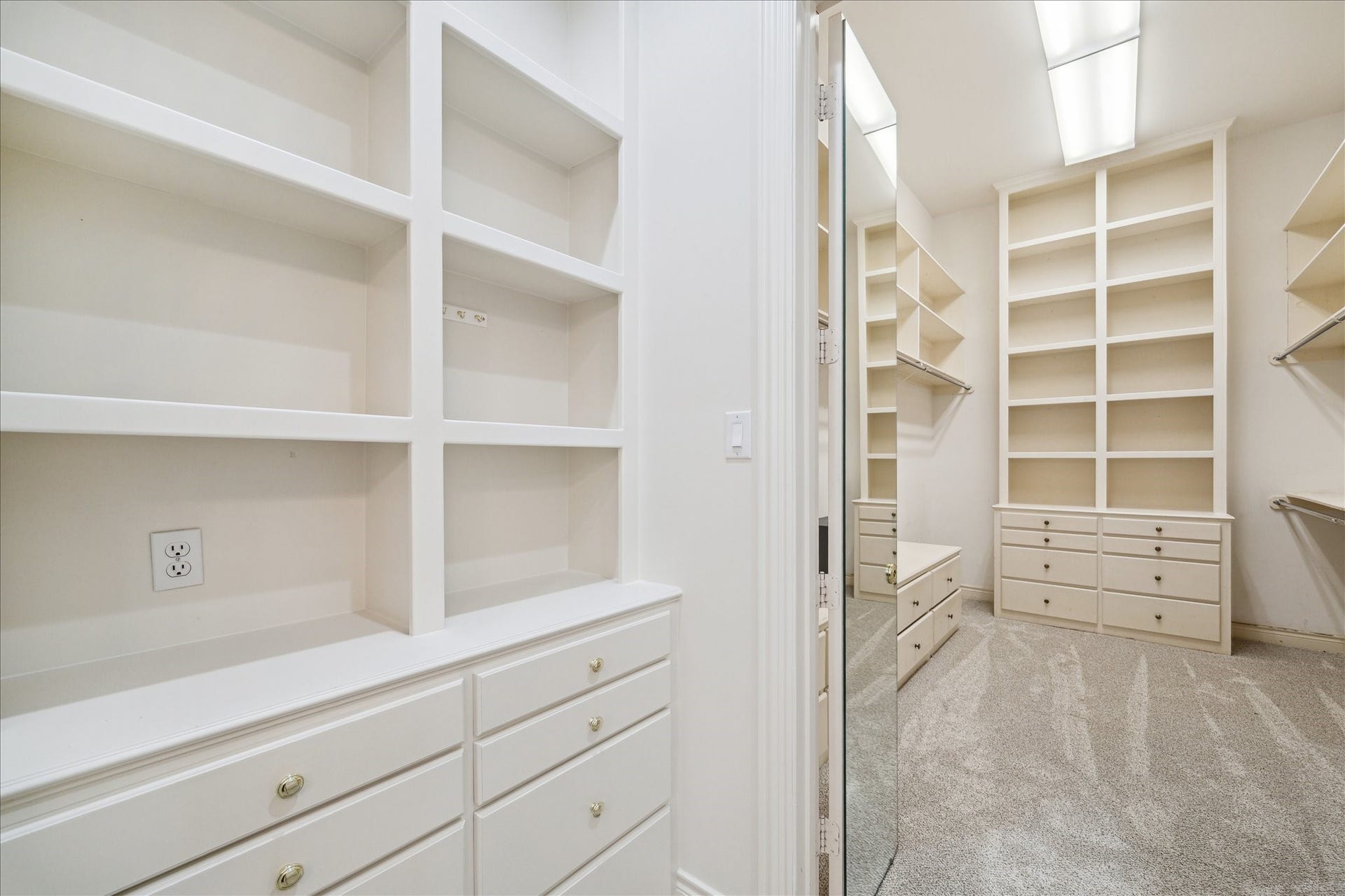 38 Scotsmoor Court, Sugar Land, TX 77479 A fully built out walk in closet is one of two separate closets in the primary suite off the bath with it's own vanity area.
