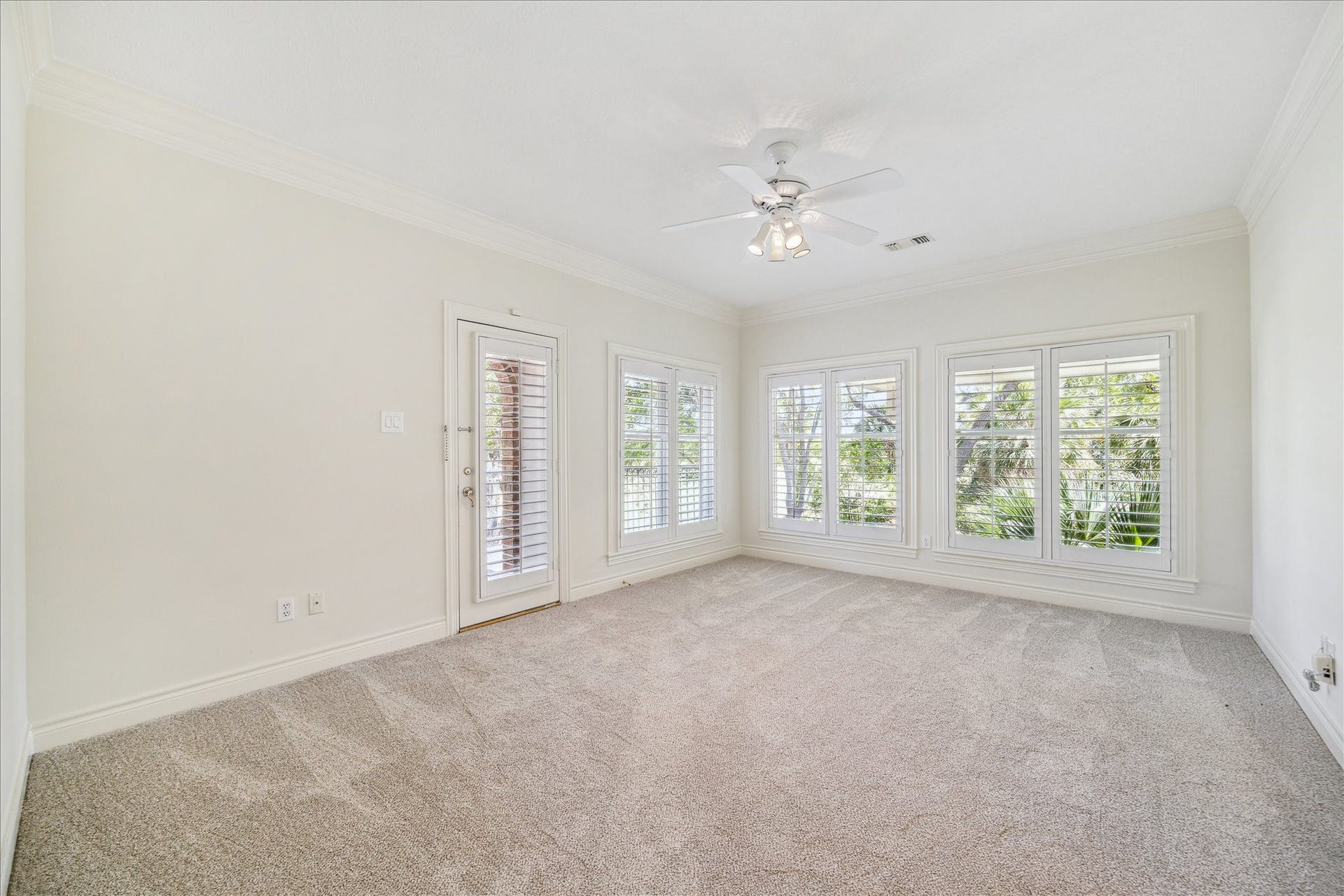 38 Scotsmoor Court, Sugar Land, TX 77479 This beautiful fourth bedroom with it's own access to a private balcony and plantation shutters enjoys a view of the golf course.