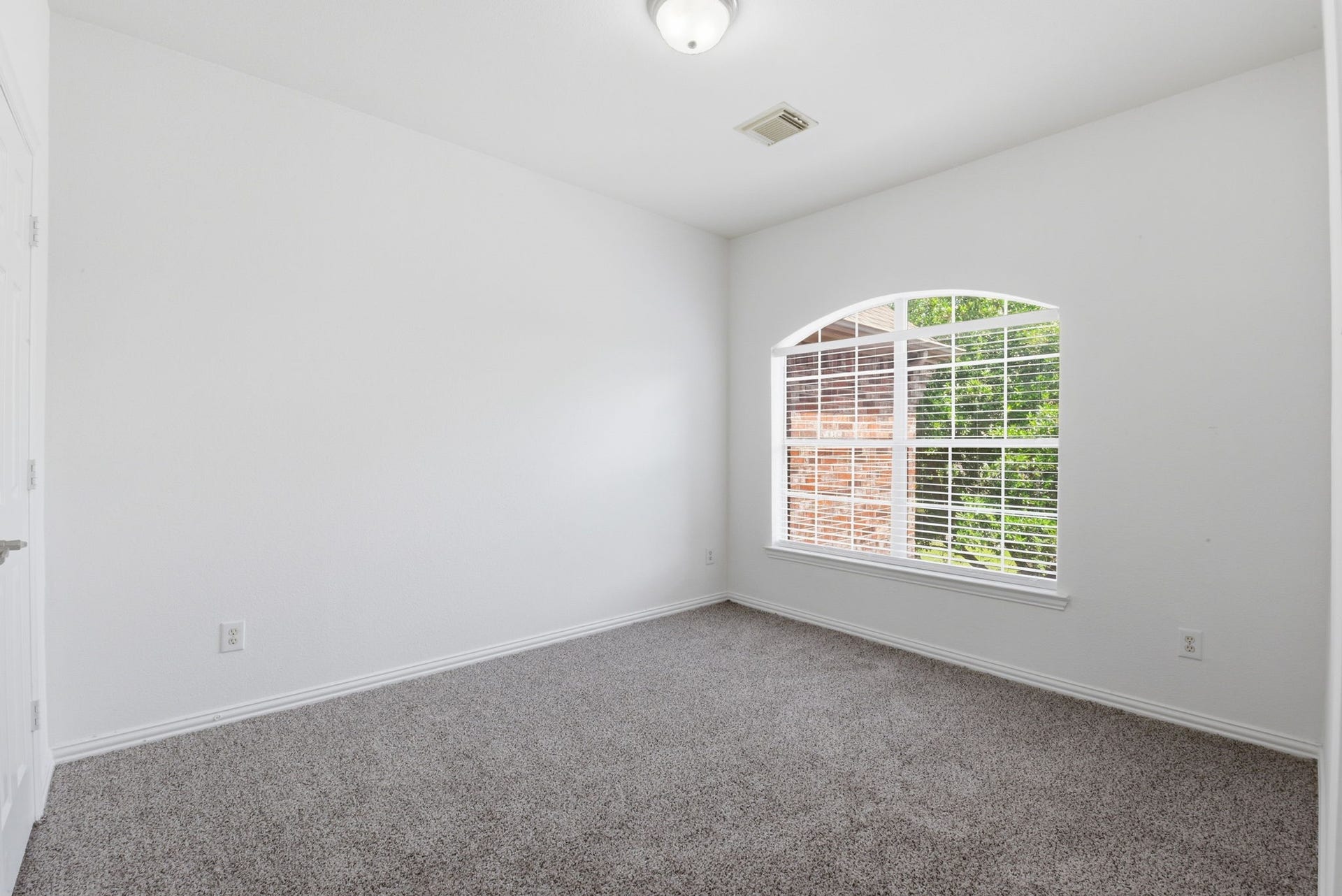16023 Powder Springs Lane, Houston, TX 77070 Second bedroom upstairs with fresh neutral paint, recently replaced carpet and a fantastic window letting in so much natural light!
