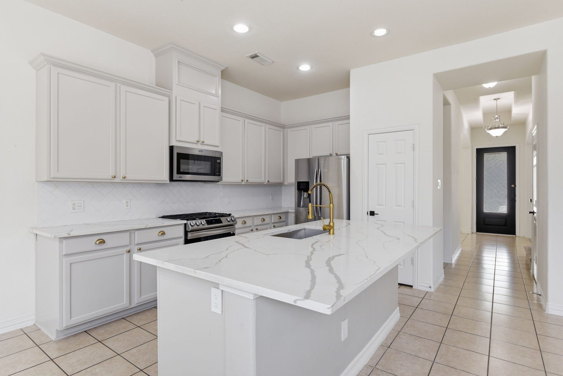 16023 Powder Springs Lane, Houston, TX 77070 The updated quartz counter tops, freshly painted cabinets with updated hardware just make this kitchen pop! The updated faucet adds such a modern touch. Recently replaced stove!