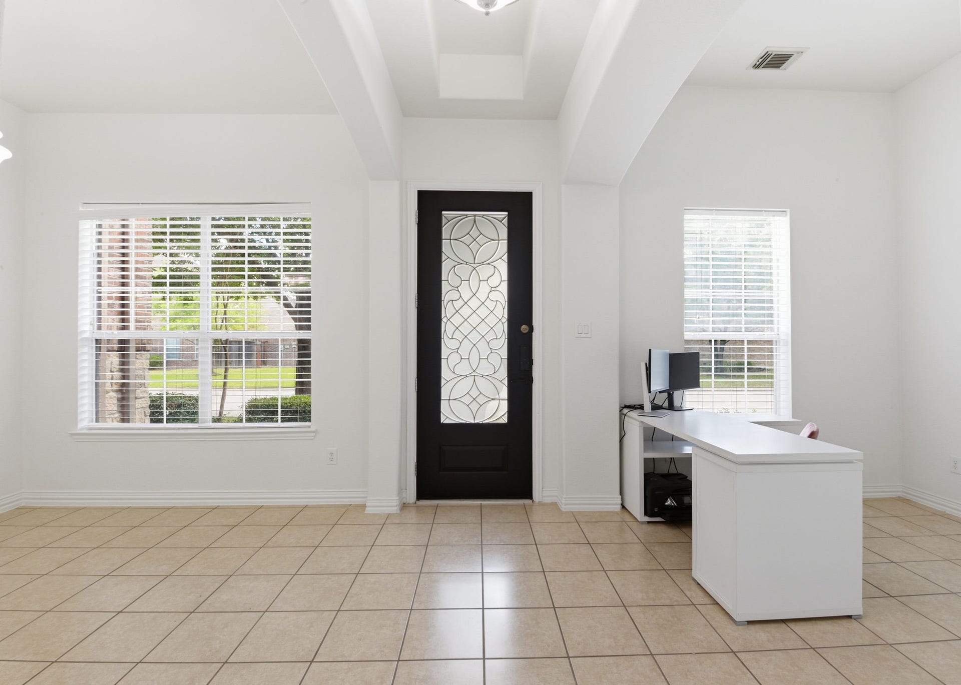 16023 Powder Springs Lane, Houston, TX 77070 Beautiful wood/glass front door opens up to a huge entry way! To the left in this picture is the formal dining area. To the right is a flex space that has been used as the home office!