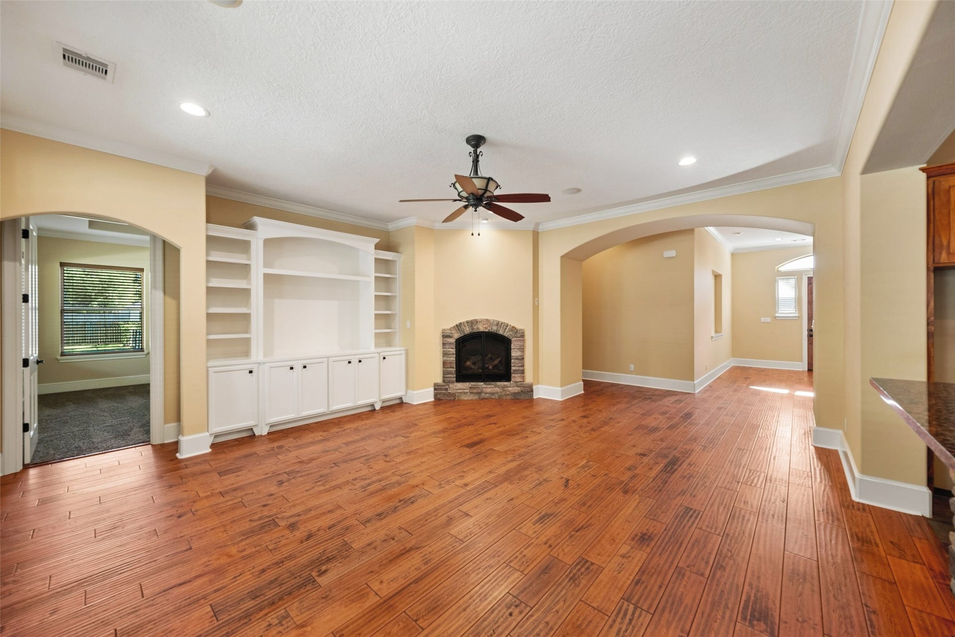 Family room also features built in and gas log fireplace