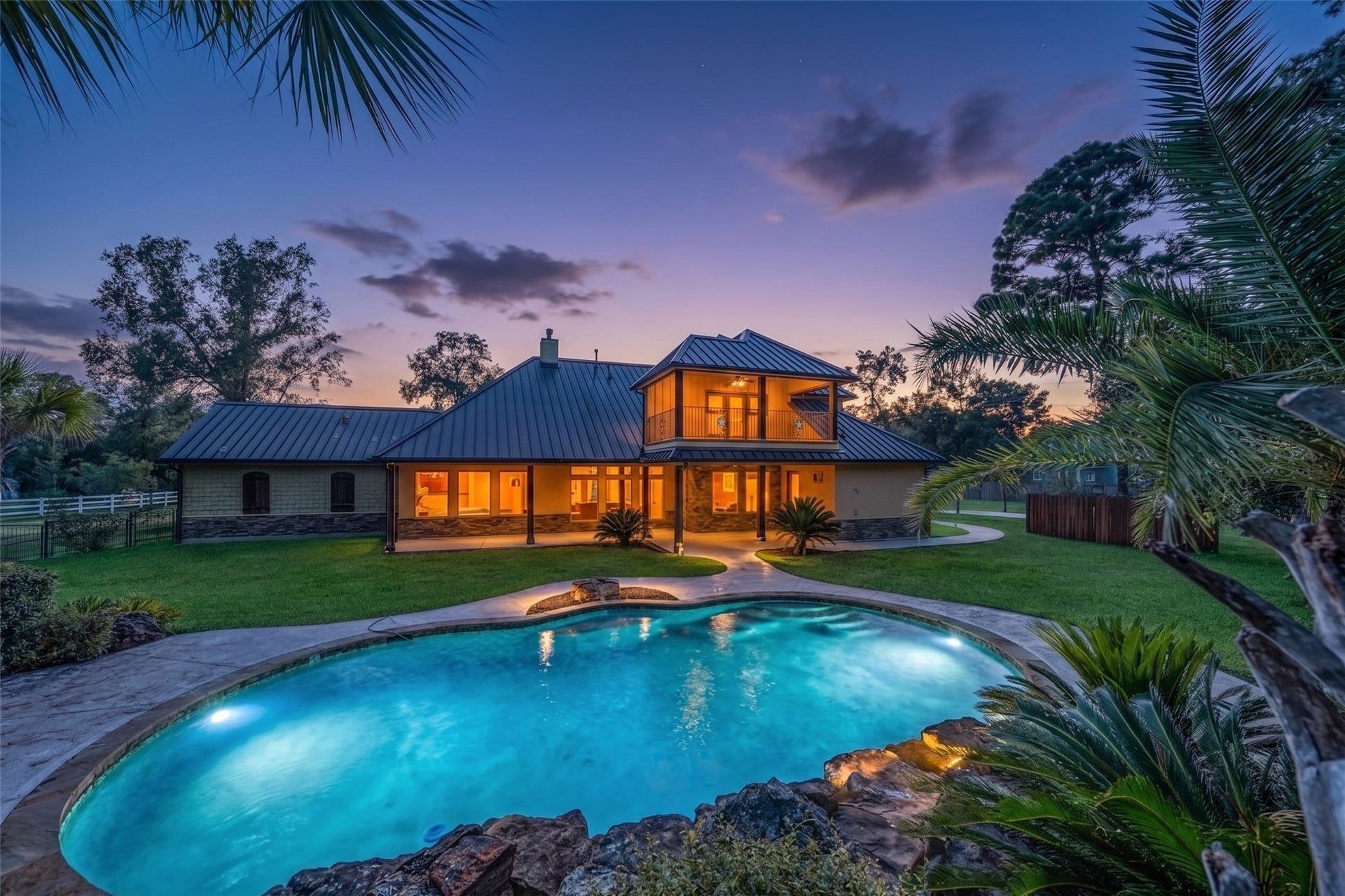Luxurious swimming pool and separate hot tub nestled in a serene Palapa setting.