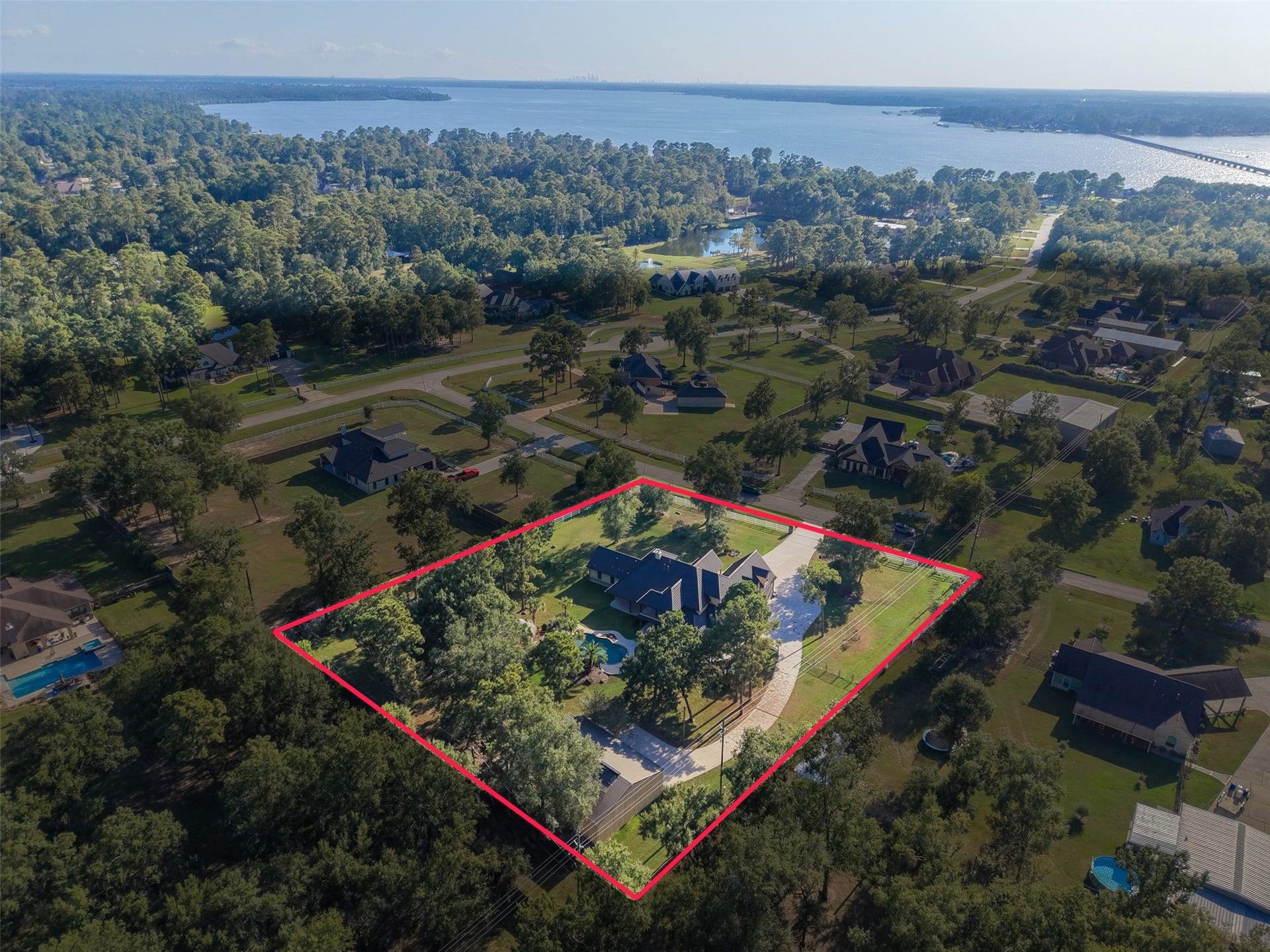 Expansive property nestled in lush greenery, offering privacy and scenic views, just moments from the water.