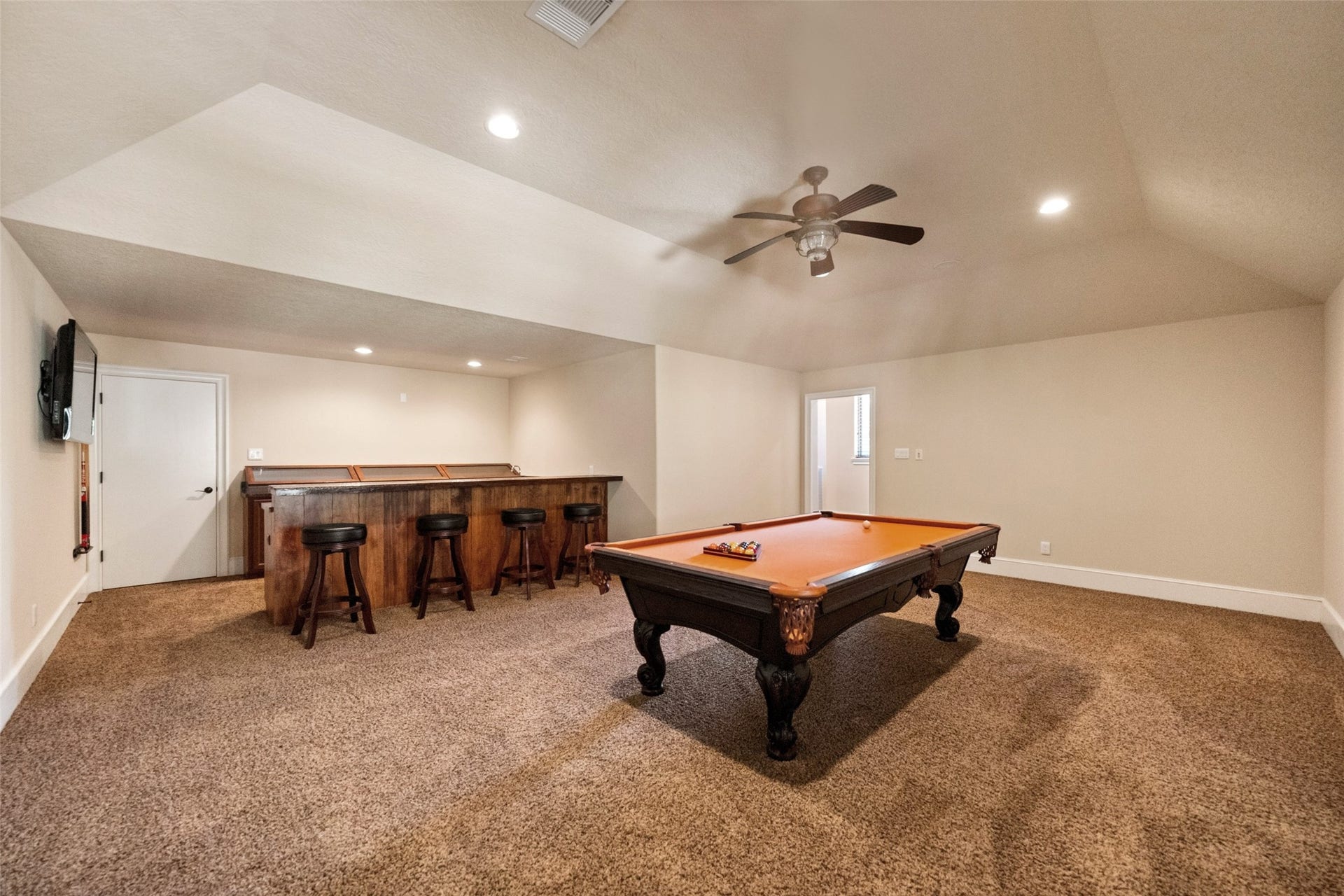 Enjoy endless entertainment in the game room, complete with a pool table that stays with the home.