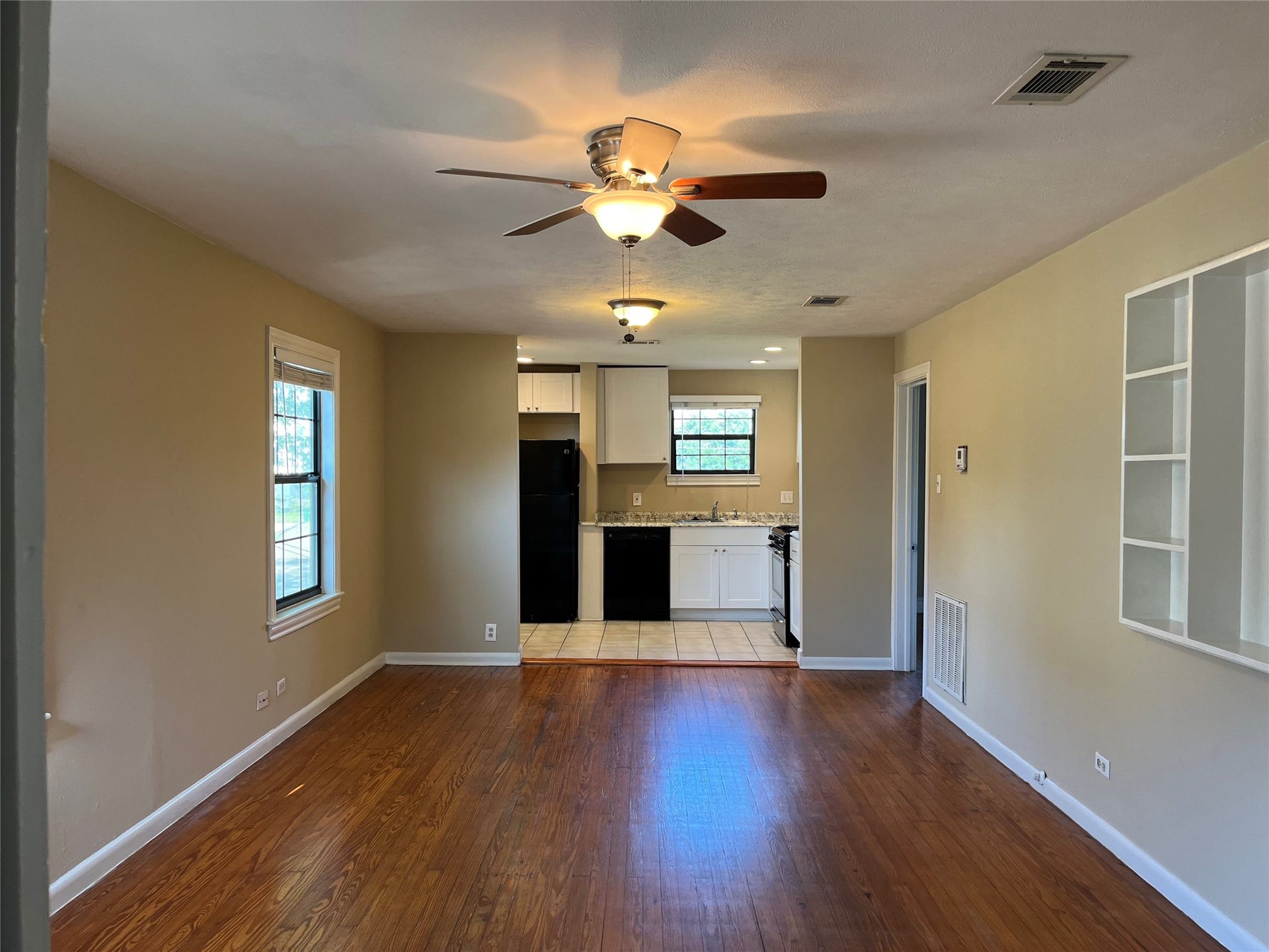 A view into  Unit #3 of the property from the front door.  Wood floors throughout, fresh paint, and plenty of natural light.