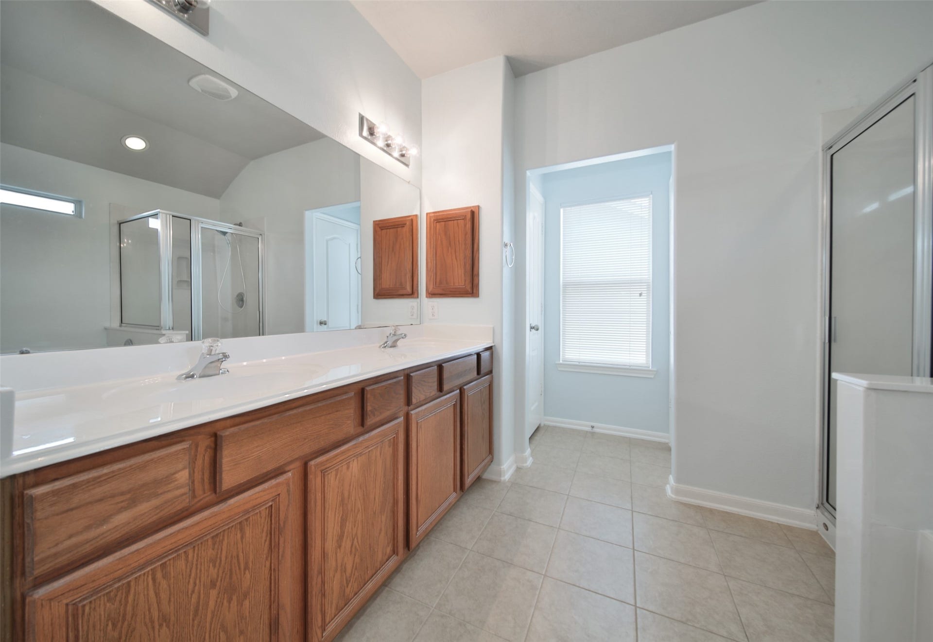 Spacious primary ensuite bath, with soaker tub, separate shower, linen closet and extended vanity with double sinks.
