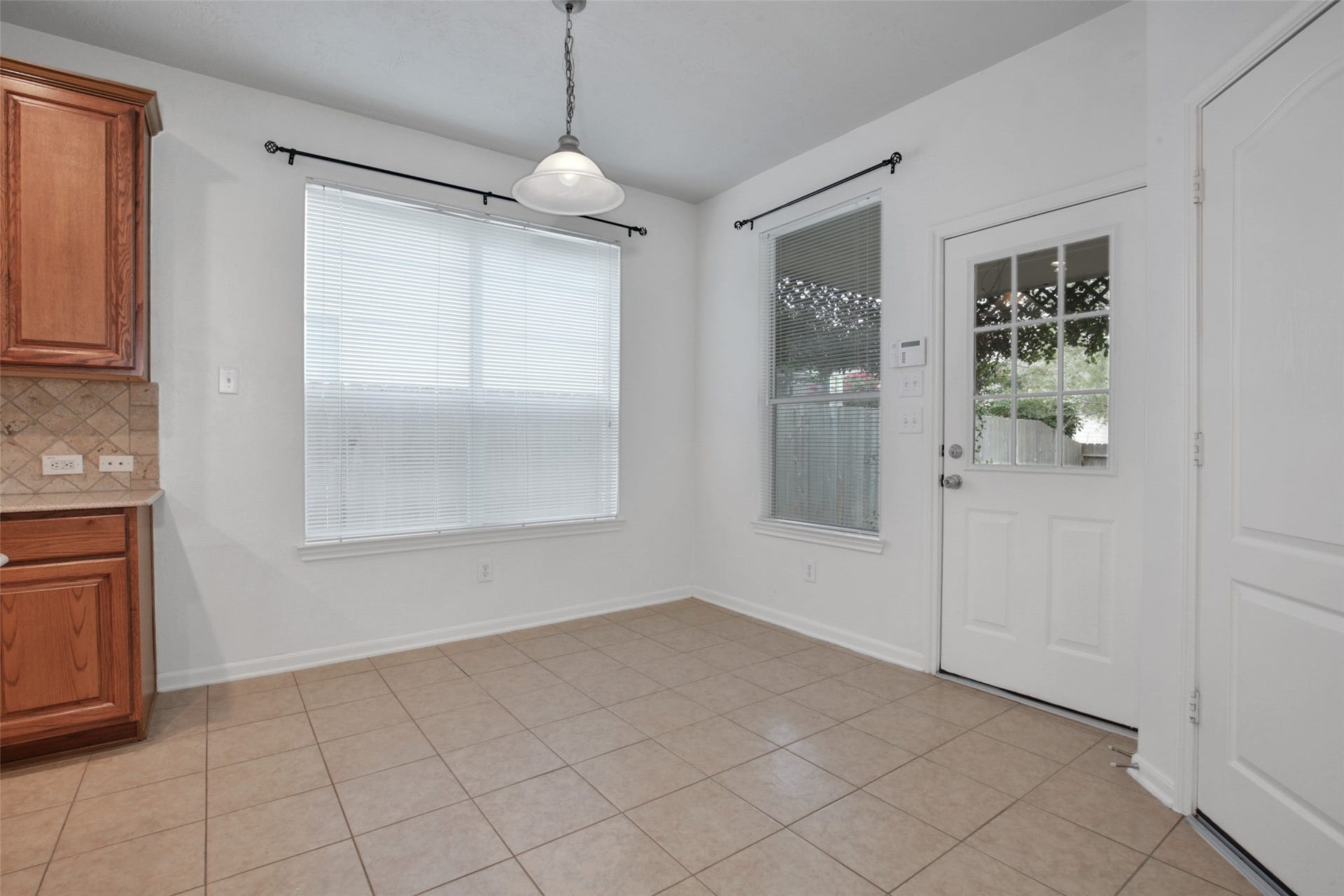 Breakfast room with patio door to the backyard.