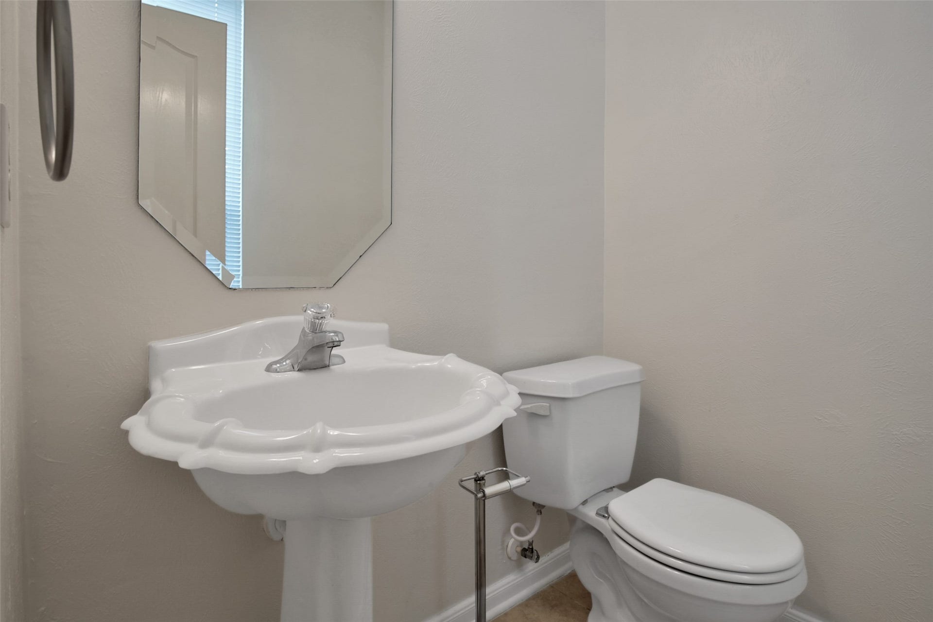 Half bath conveniently located downstairs.