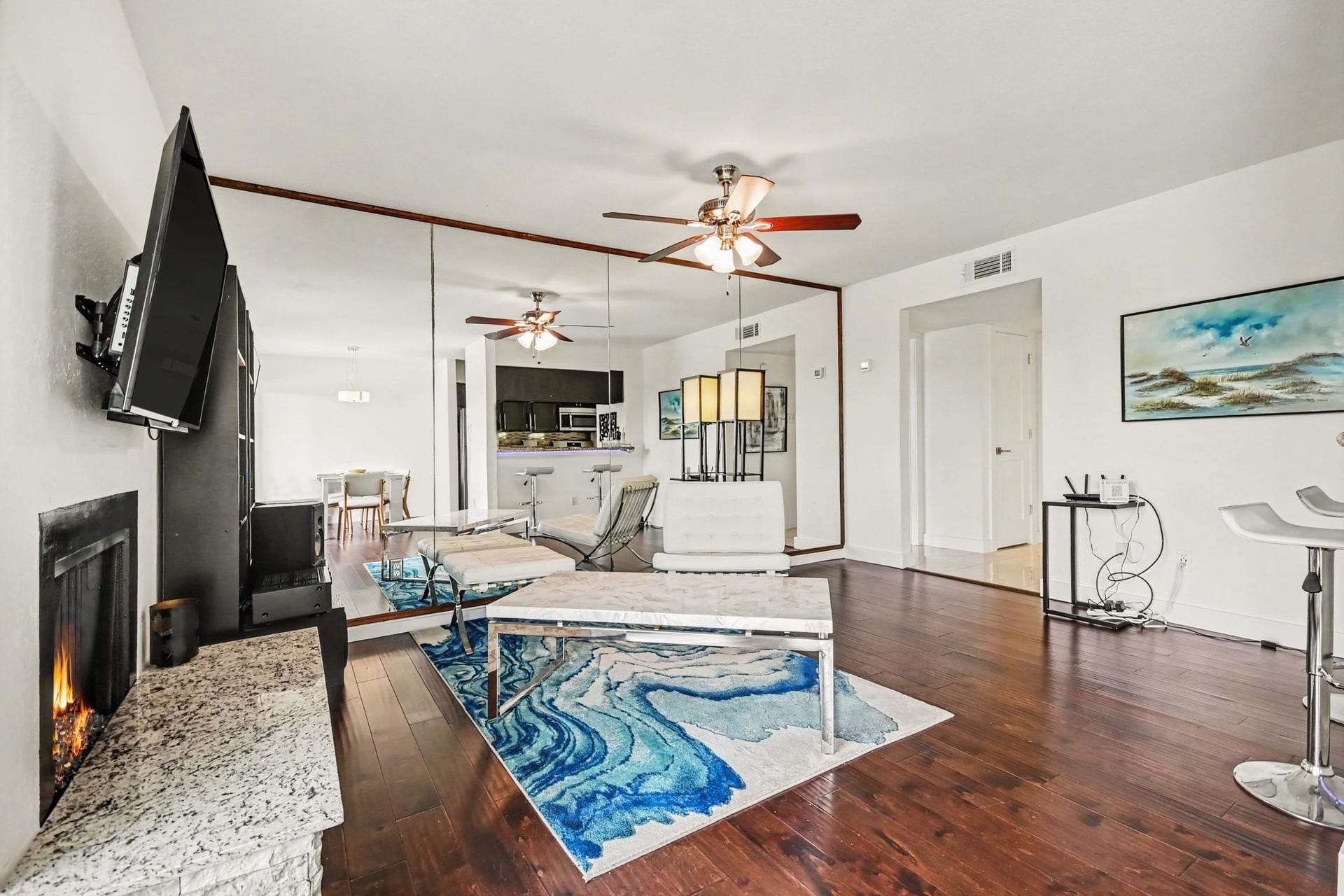 18511 Egret Bay Boulevard, #102, Webster, TX 77058 Open living area with fireplace and breakfast bar
