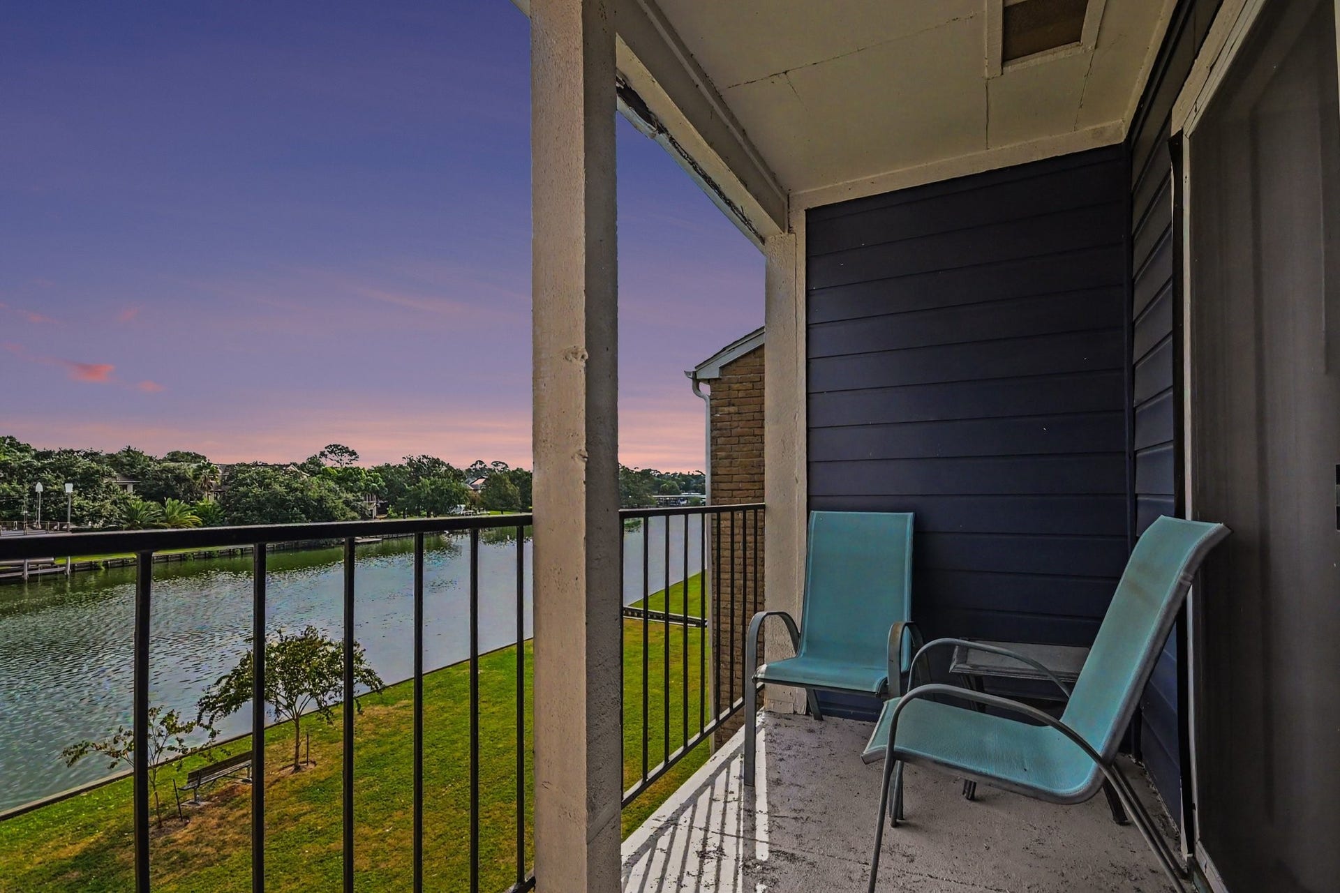 18511 Egret Bay Boulevard, #102, Webster, TX 77058 Twilight waterfront view from the covered balcony