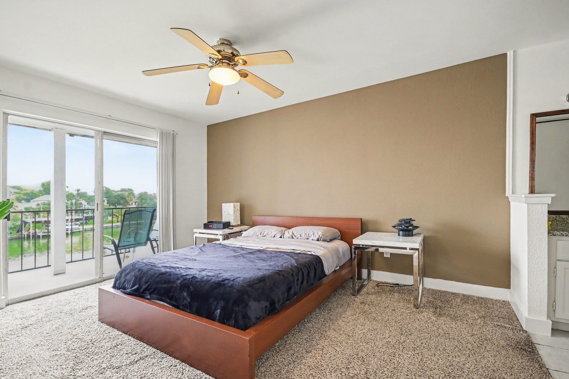 18511 Egret Bay Boulevard, #102, Webster, TX 77058 Spacious primary bedroom with waterfront balcony access