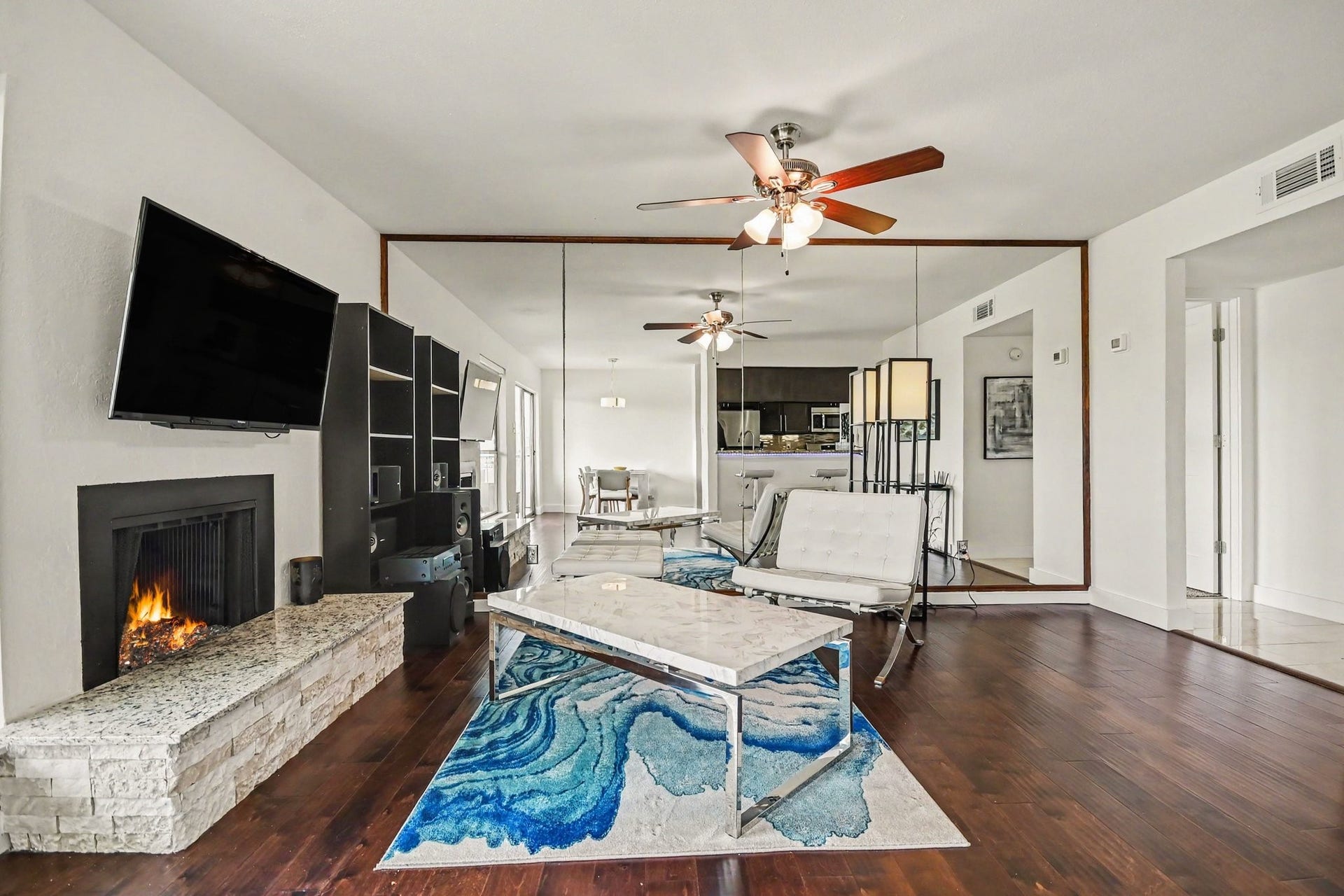 18511 Egret Bay Boulevard, #102, Webster, TX 77058 Additional view of the open living area and fireplace
