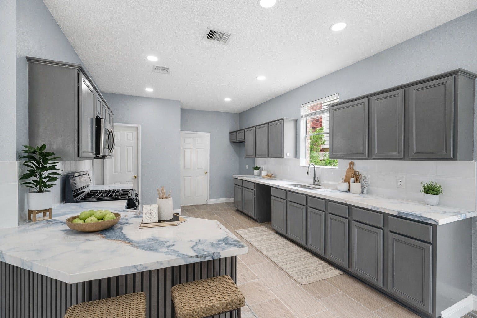 2623 Pine Shadows Drive, Sugar Land, TX 77479 Updated, spacious kitchen with gorgeous quartz countertops, under-cabinet lighting, and tons of natural light