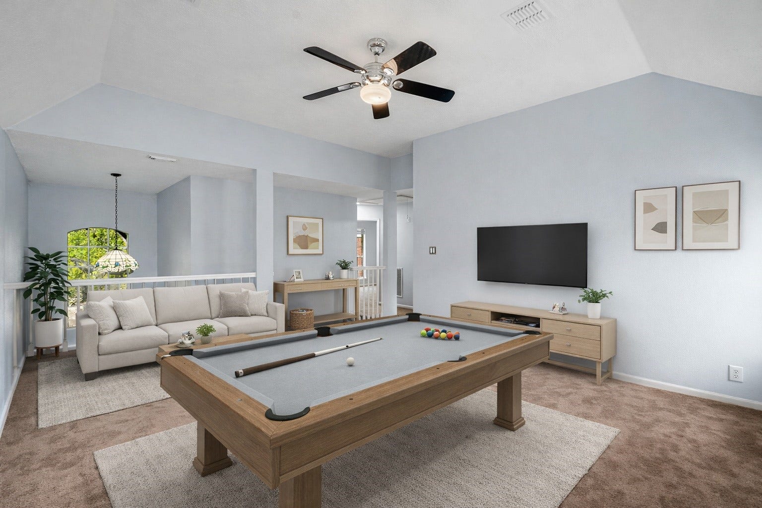 2623 Pine Shadows Drive, Sugar Land, TX 77479 Upstairs game room overlooking the living area below, offering endless possibilities for entertaining or relaxing