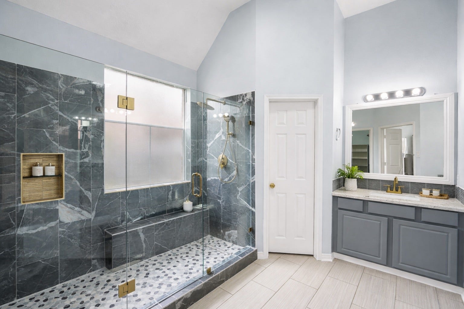 2623 Pine Shadows Drive, Sugar Land, TX 77479 Enjoy a fully redesigned primary bath showcasing a large walk-in shower with dual shower heads for a spa-like experience