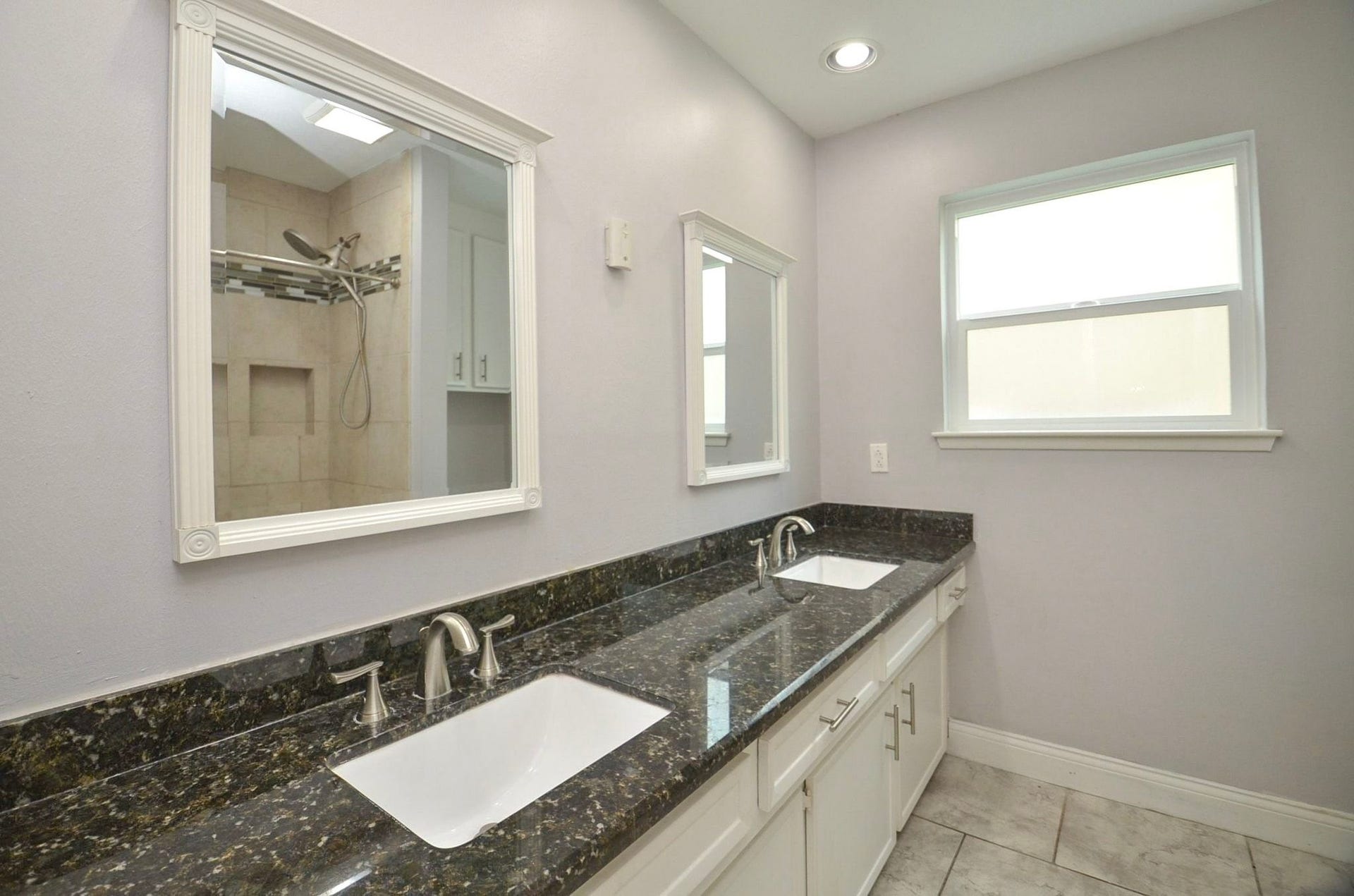 Updated Hall Bath with Operable Low-E Window.