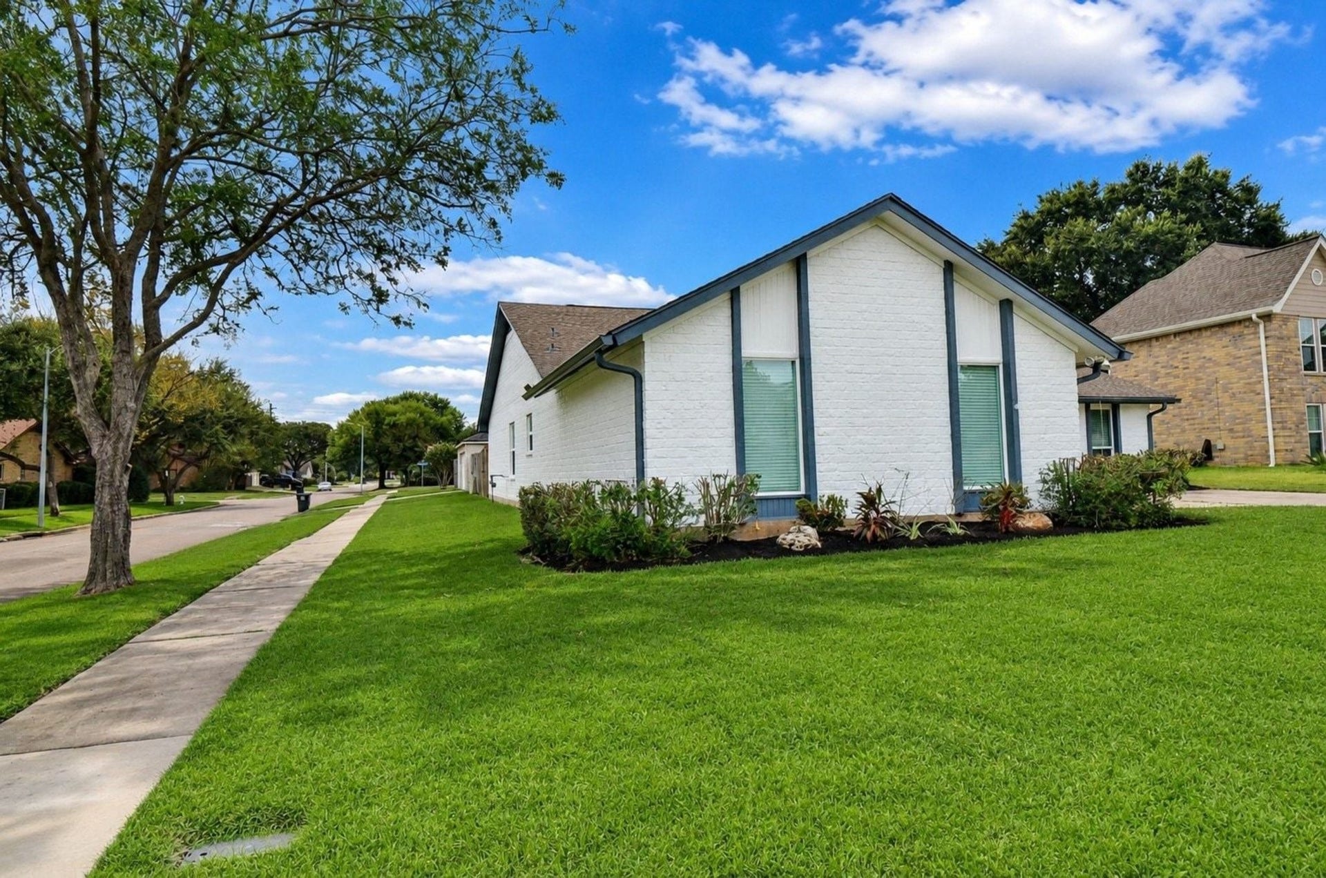 Professionally Painted Exterior with Newly Well-Planted Front Landscape.