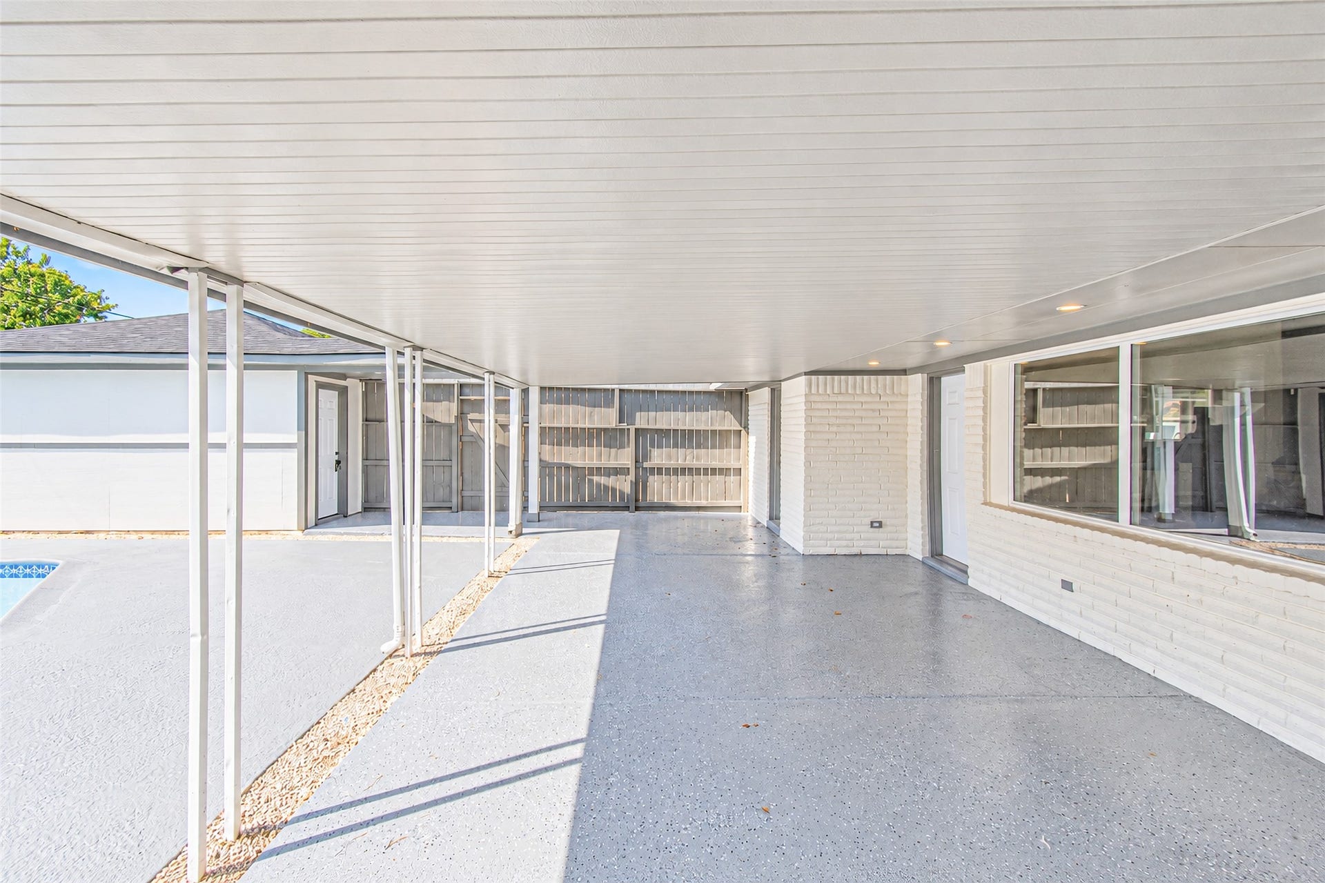 7623 Braes Meadow Drive, Houston, TX 77071 Experience seamless indoor-outdoor living in this expansive patio area, enhanced by energy-efficient low-E windows that invite natural light while maintaining comfort.