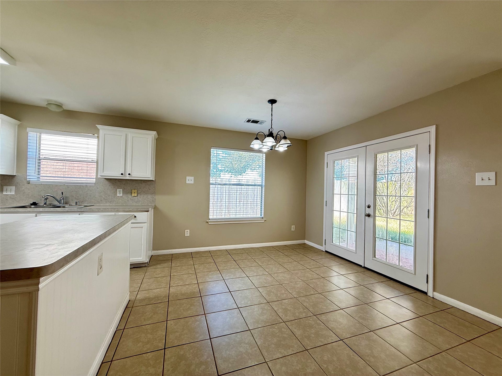 21514 Broadstone Drive, Katy, TX 77449 View of the breakfast area with double doors leading out to the backporch.