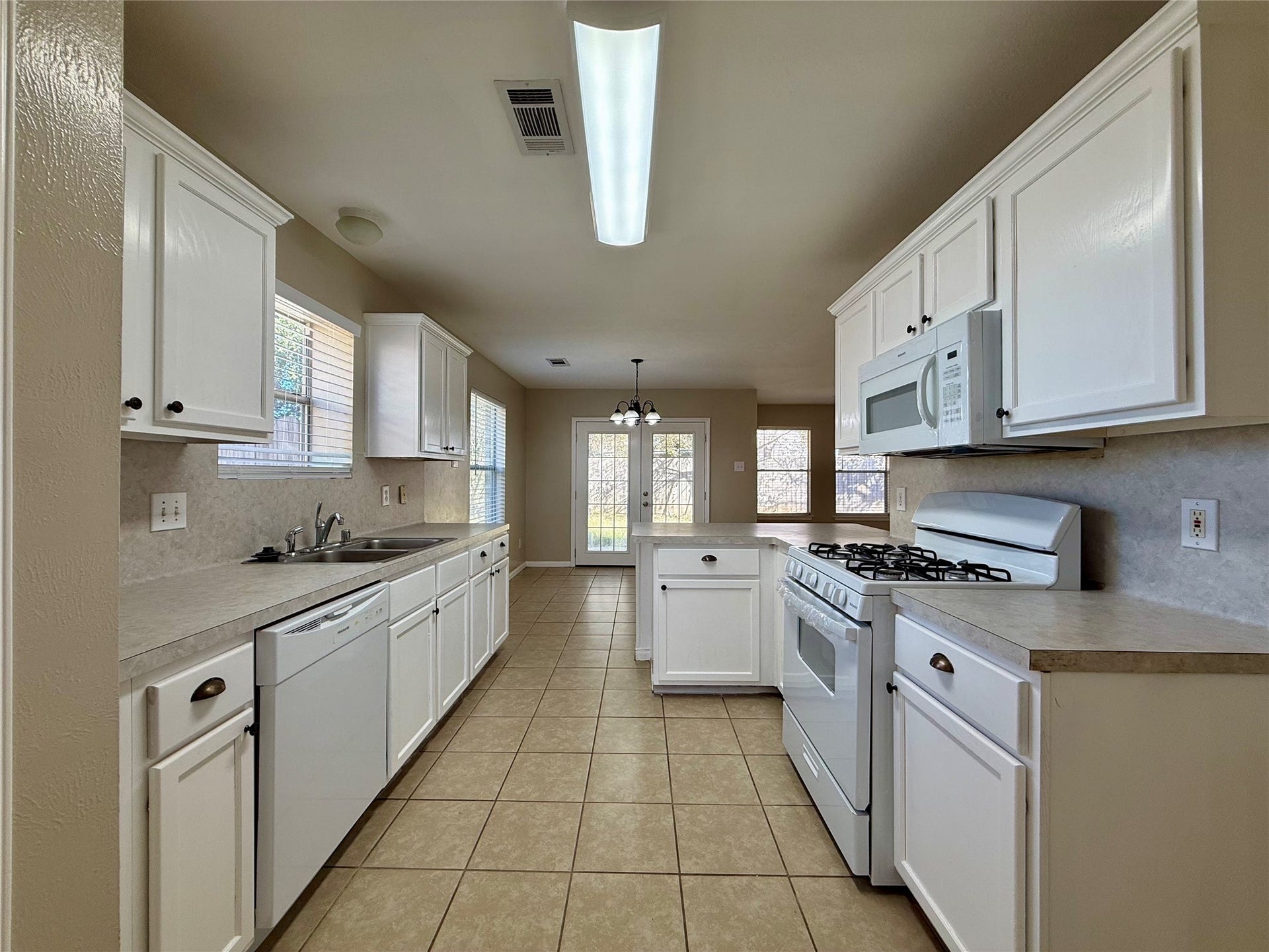 21514 Broadstone Drive, Katy, TX 77449 The spacious kitchen includes a new gas cooktop/oven and new dishwasher.