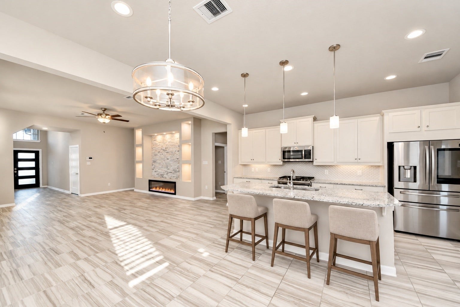 6110 Dovetail Cliff Court, Katy, TX 77493 Spacious open concept layout seamlessly connecting the kitchen, dining area, and living room.