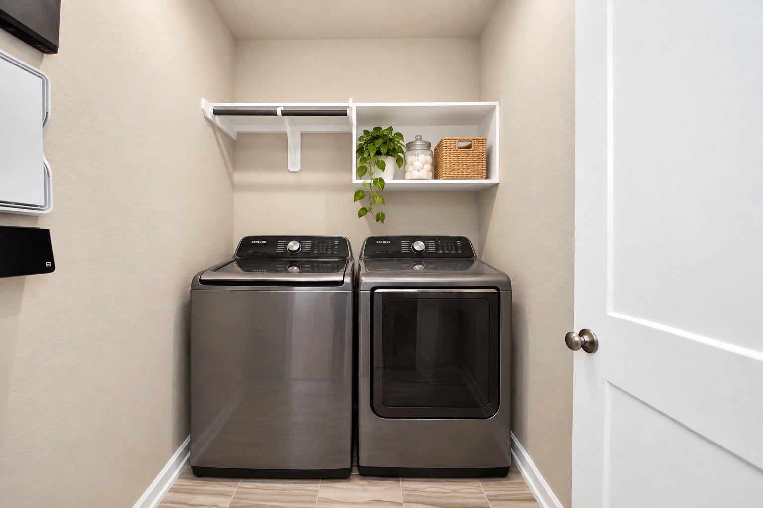 6110 Dovetail Cliff Court, Katy, TX 77493 Convenient indoor utility room with built-in shelving and space for full sized laundry appliances.
