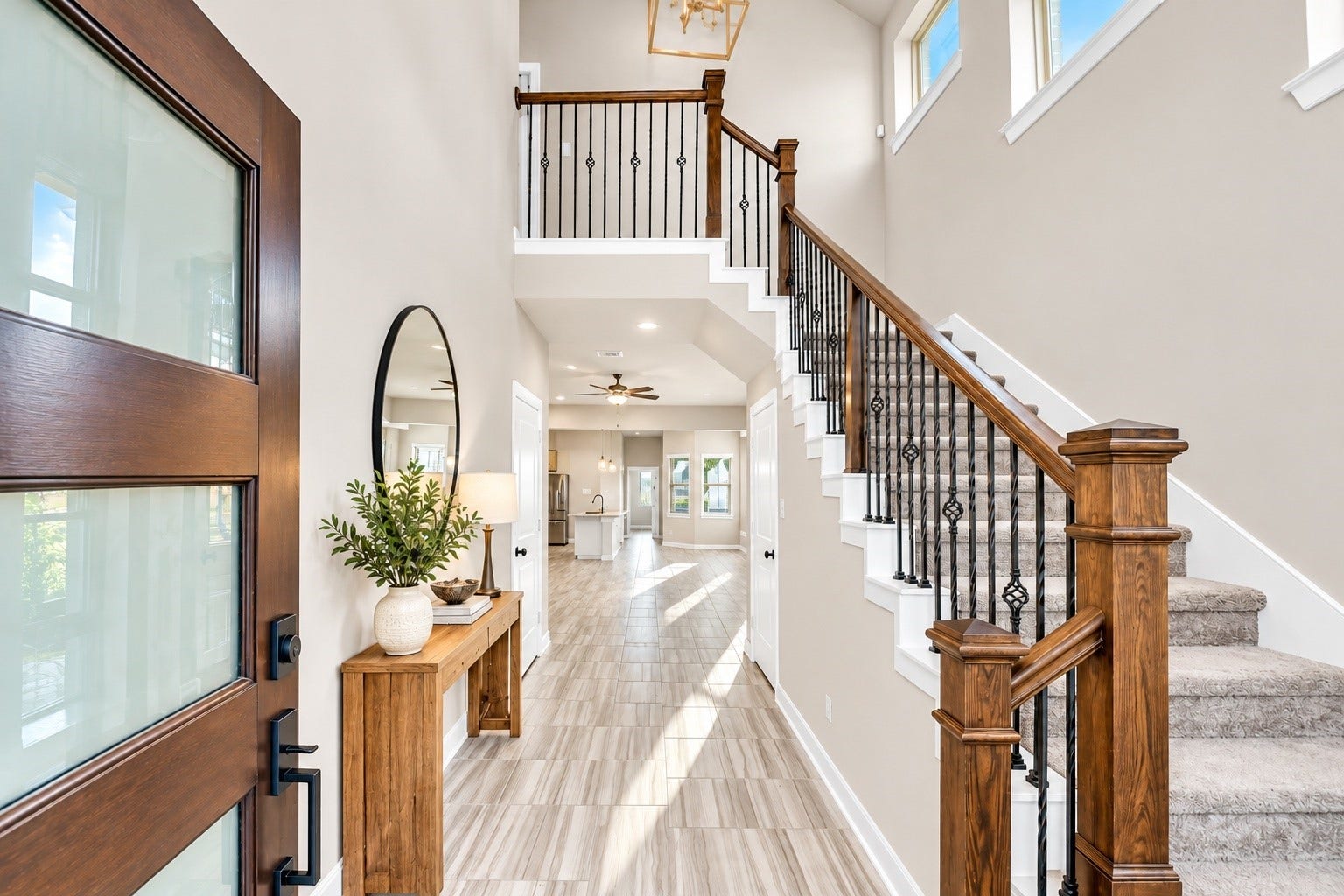 6110 Dovetail Cliff Court, Katy, TX 77493 Welcoming entryway with soaring ceilings, an elegant staircase, and abundant natural light.