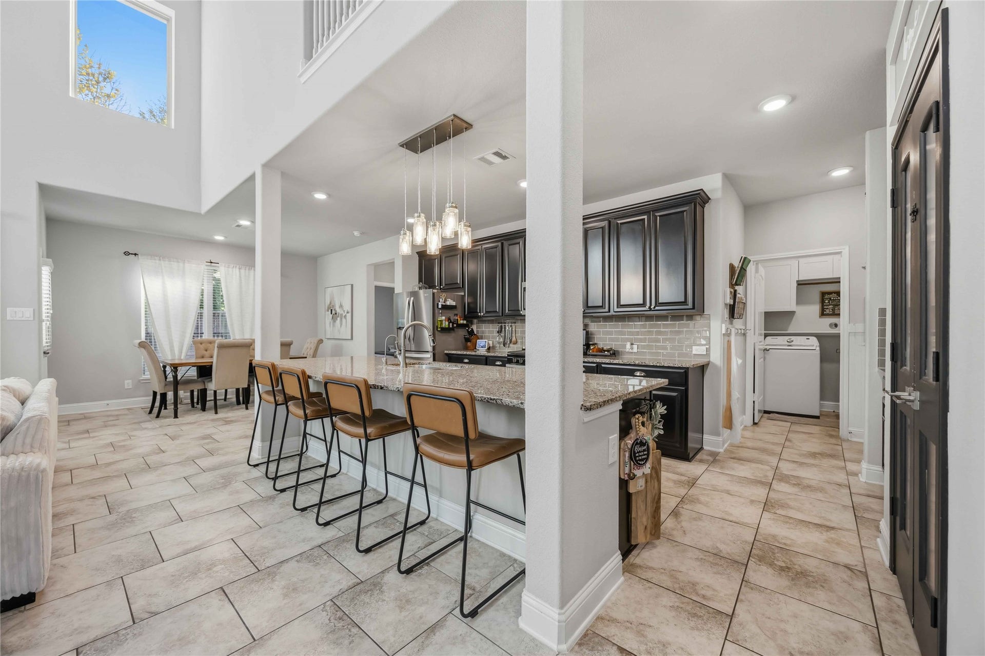3152 Copeland Bend, Conroe, TX 77301 Pull up a stool at the island, with seating for four looking out over the dining area.