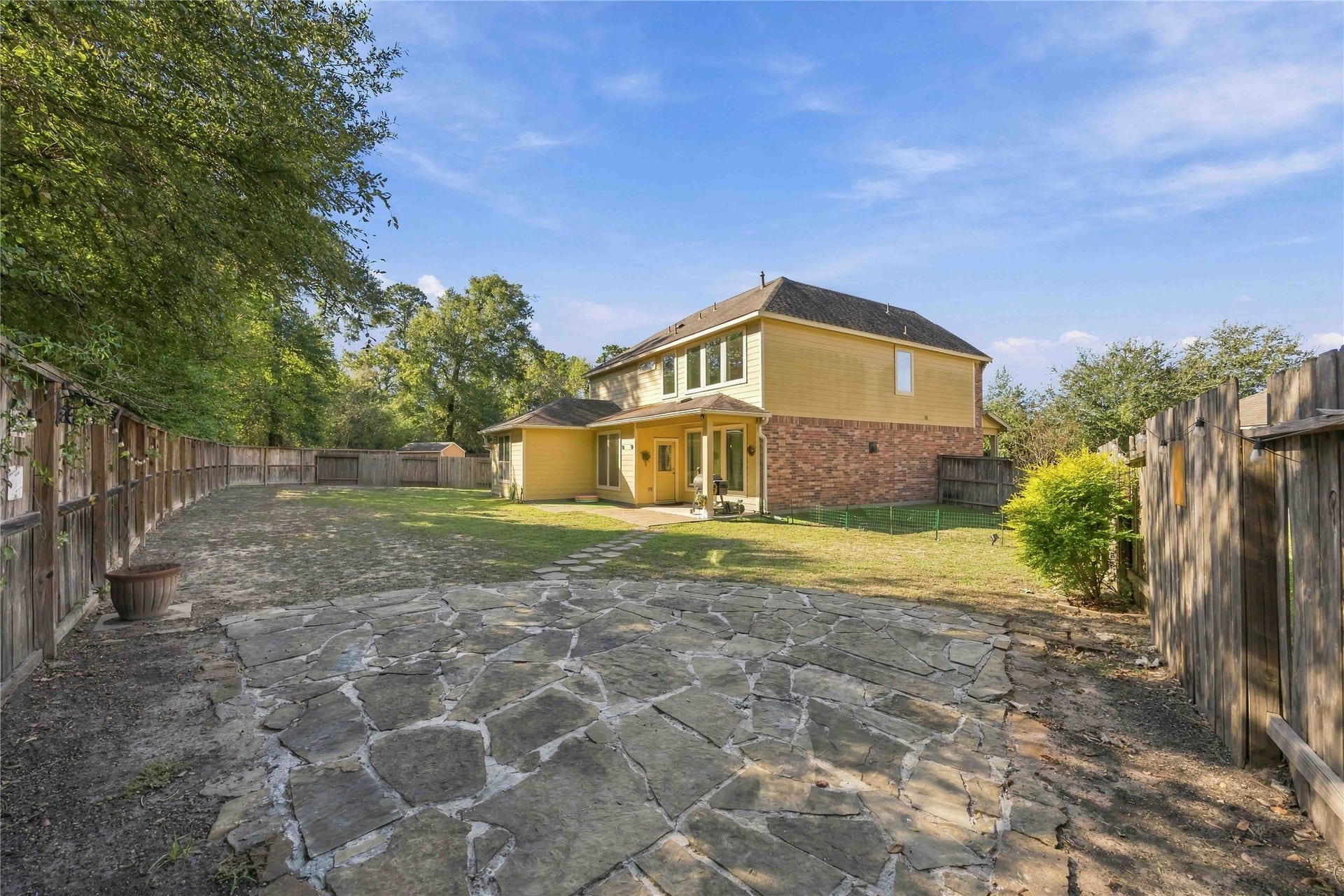 3152 Copeland Bend, Conroe, TX 77301 A stone pathway winds through the backyard, the perfect last stroll before you call this home.