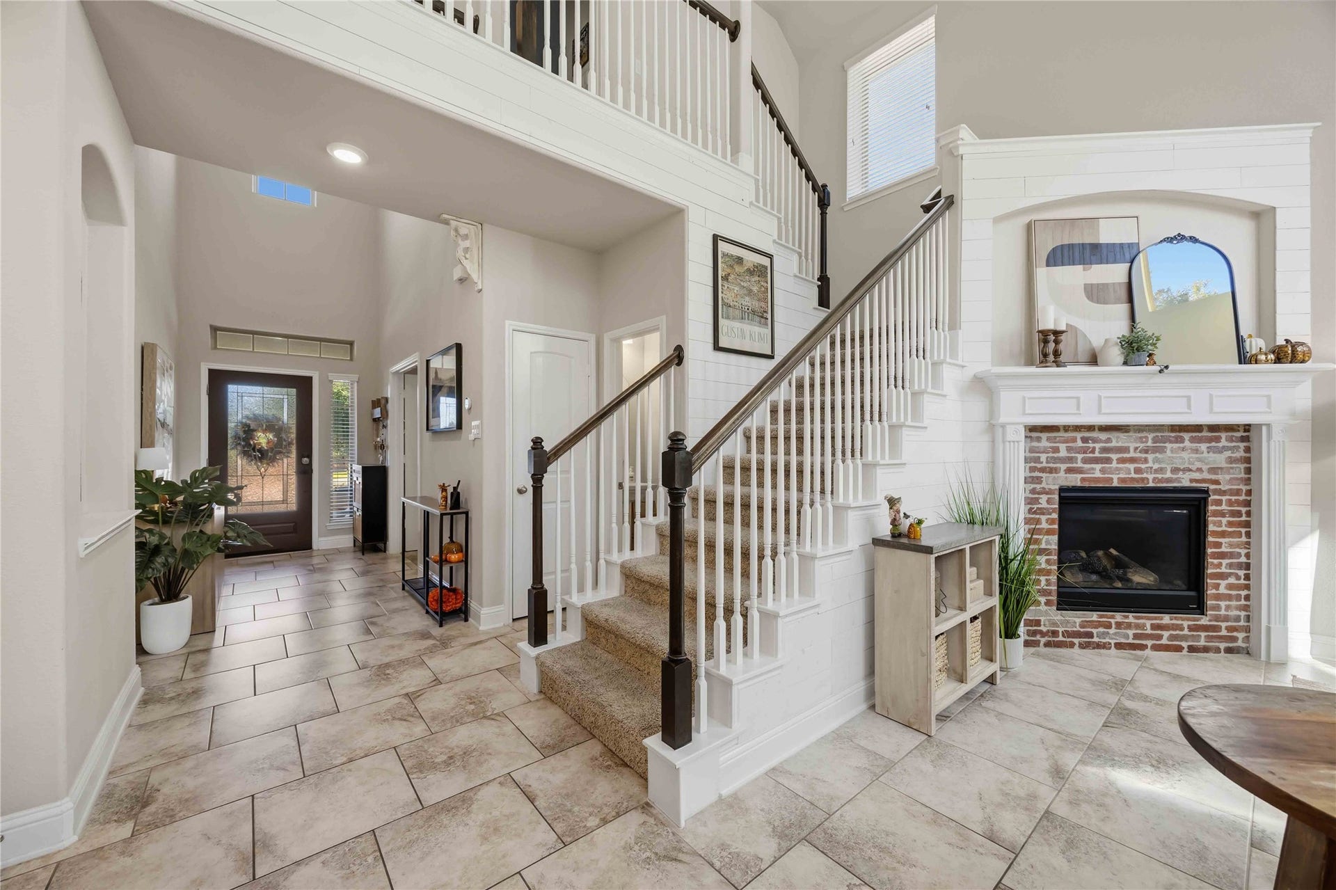 3152 Copeland Bend, Conroe, TX 77301 The full mosaic fireplace steals the show, a true showpiece beside the staircase.