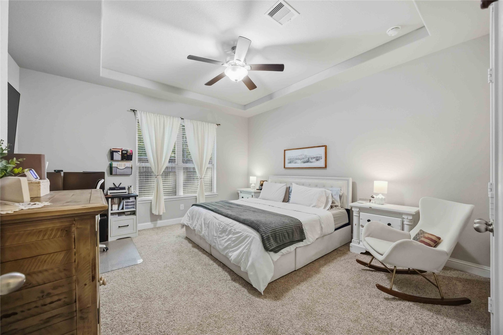 3152 Copeland Bend, Conroe, TX 77301 Retreat to the main-floor primary suite, where a tray ceiling adds a sense of calm and space.