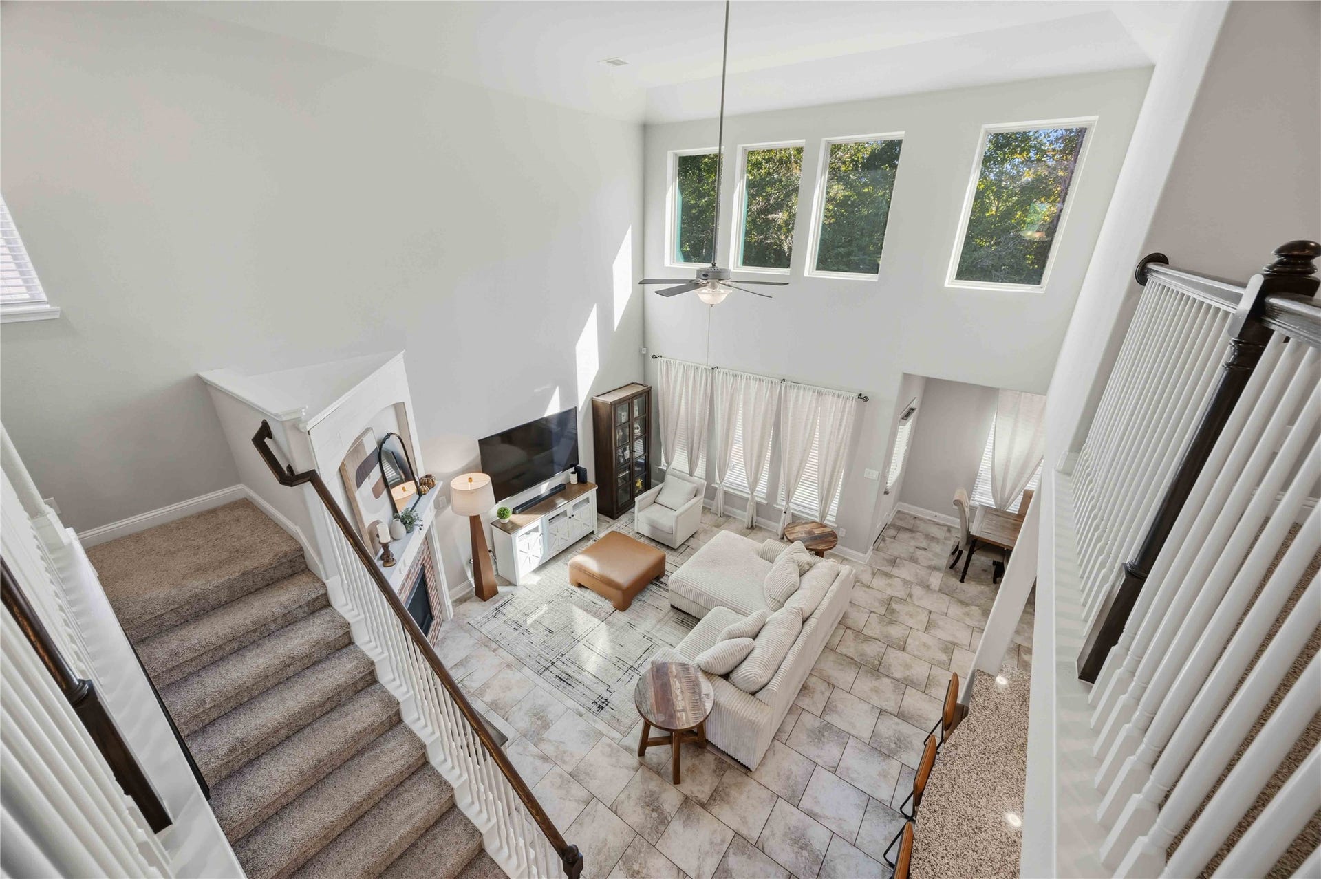 3152 Copeland Bend, Conroe, TX 77301 Look down from the overlook to see just how open and airy the living room feels.