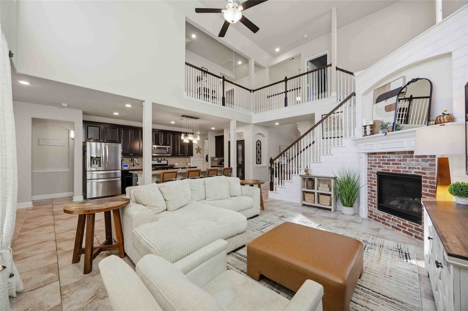 3152 Copeland Bend, Conroe, TX 77301 The heart of the home opens up, with living, kitchen, and the upstairs overlook all flowing together.