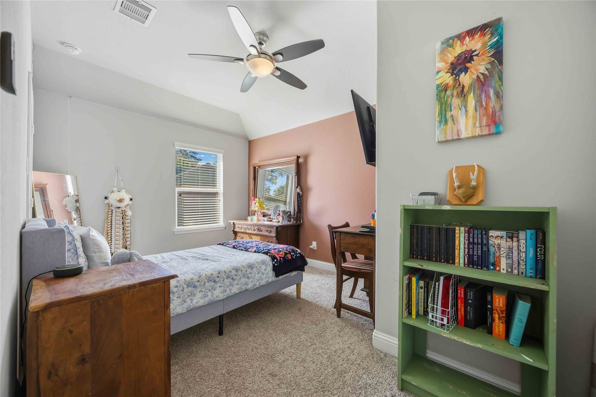 3152 Copeland Bend, Conroe, TX 77301 A sloped ceiling gives this light-filled bedroom a cozy, tucked-away feel.