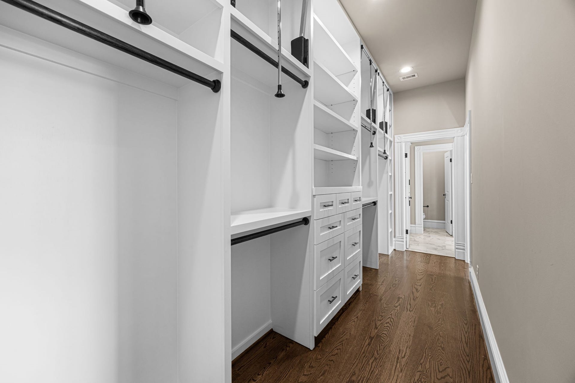 1521 Ovid Street, Houston, TX 77007 The primary closet offers floor to ceiling built-ins with endless organizing options!