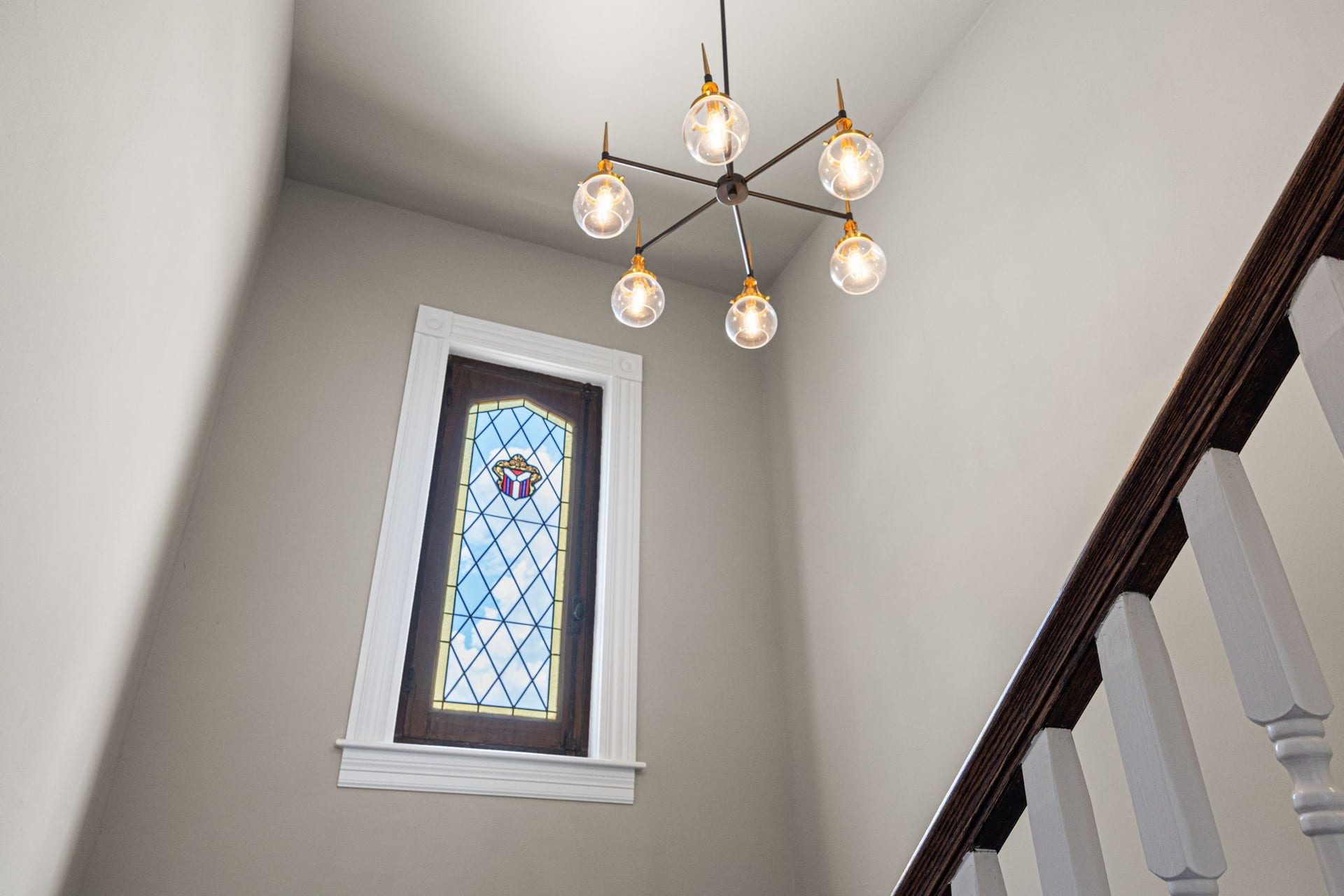 1521 Ovid Street, Houston, TX 77007 Notice the vintage reclaimed stainless glass window in the stairwell - your dose of classic charm in a modern, new construction build.