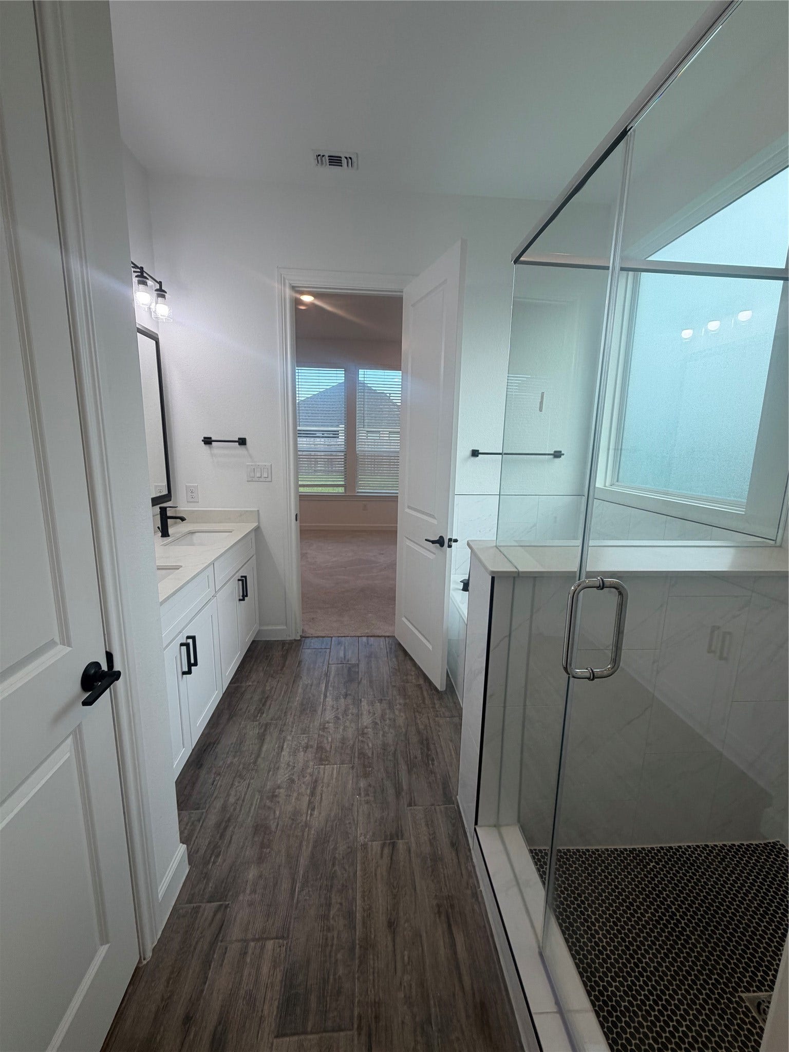 25302 Rothesay Lane, Katy, TX 77493 Spacious Primary Suite The primary bathroom features a relaxing soaking tub, separate shower