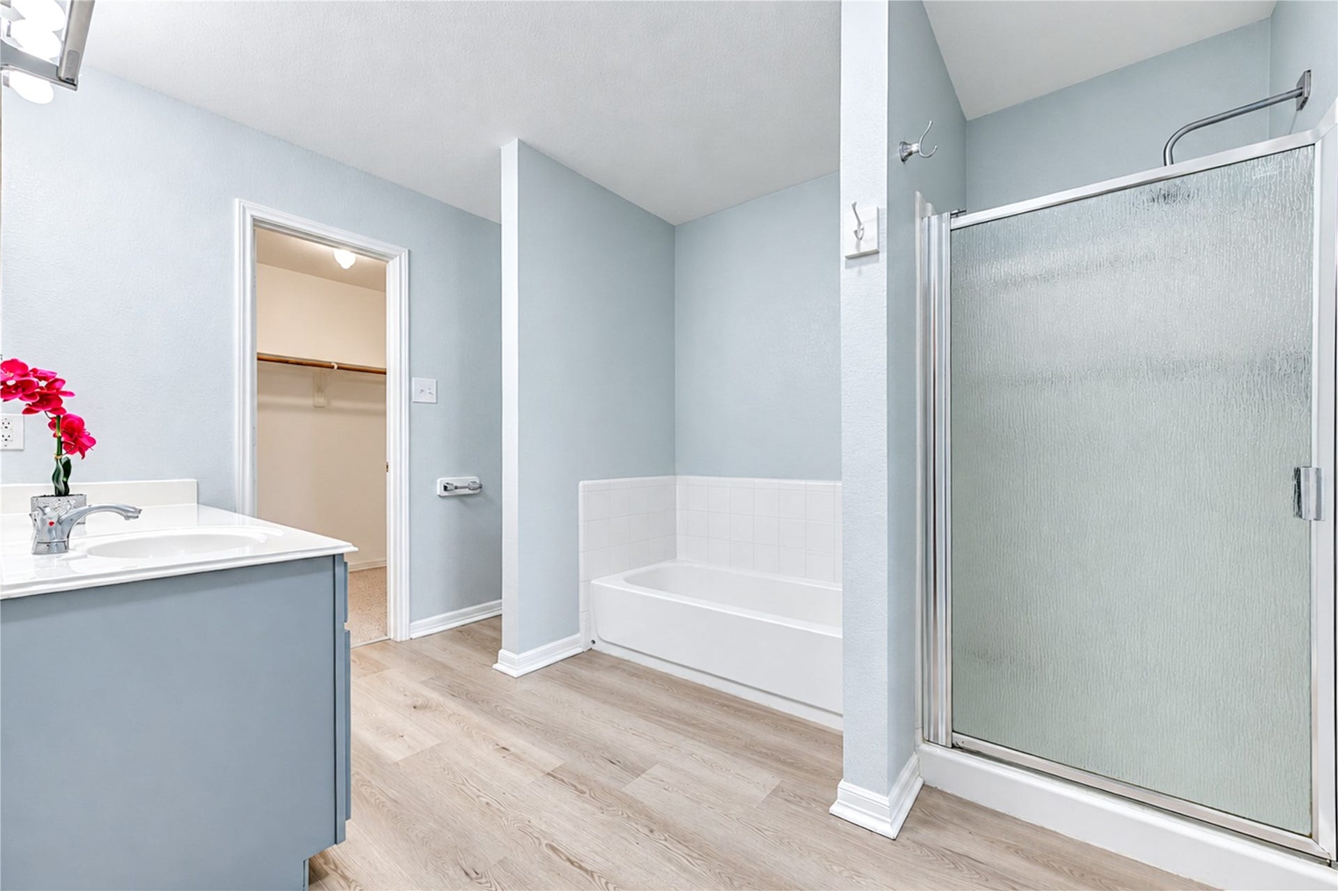 20910 Trenton Valley Lane, Katy, TX 77449 Spacious primary bath featuring a separate soaking tub and shower, generous vanity space, and direct access to the walk in closet.