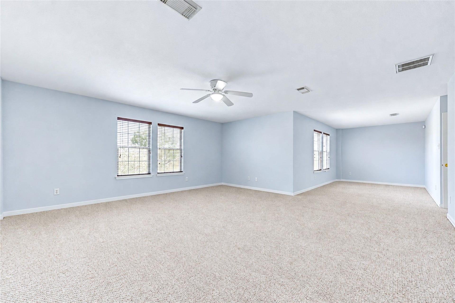 20910 Trenton Valley Lane, Katy, TX 77449 Expansive primary suite with a generous sitting area, abundant natural light, ceiling fan, and plenty of space to relax and unwind.