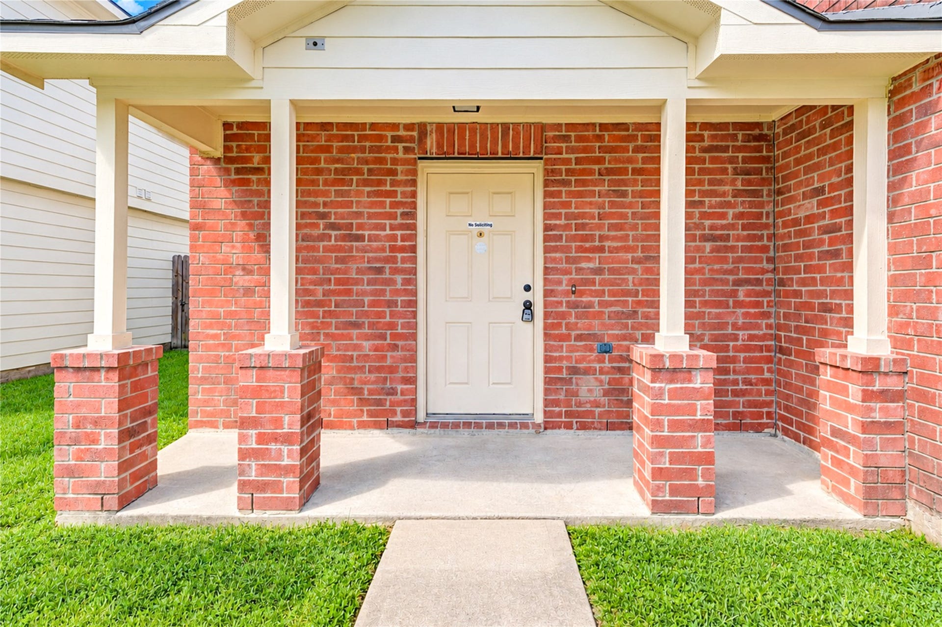 20910 Trenton Valley Lane, Katy, TX 77449 Welcoming covered front entry with classic brick detail and a charming porch that creates a warm first impression.
