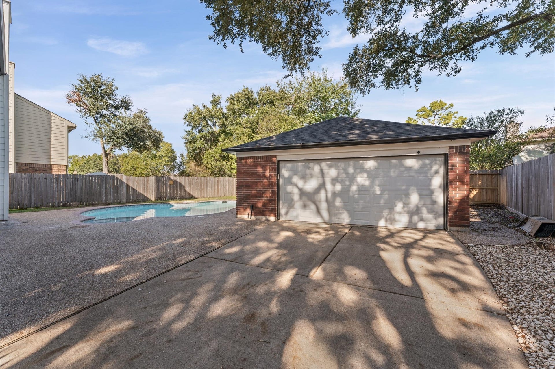 1118 Cheyenne Meadows Drive, Katy, TX 77450 The detached two-car garage sits behind the home, beyond the gated driveway.