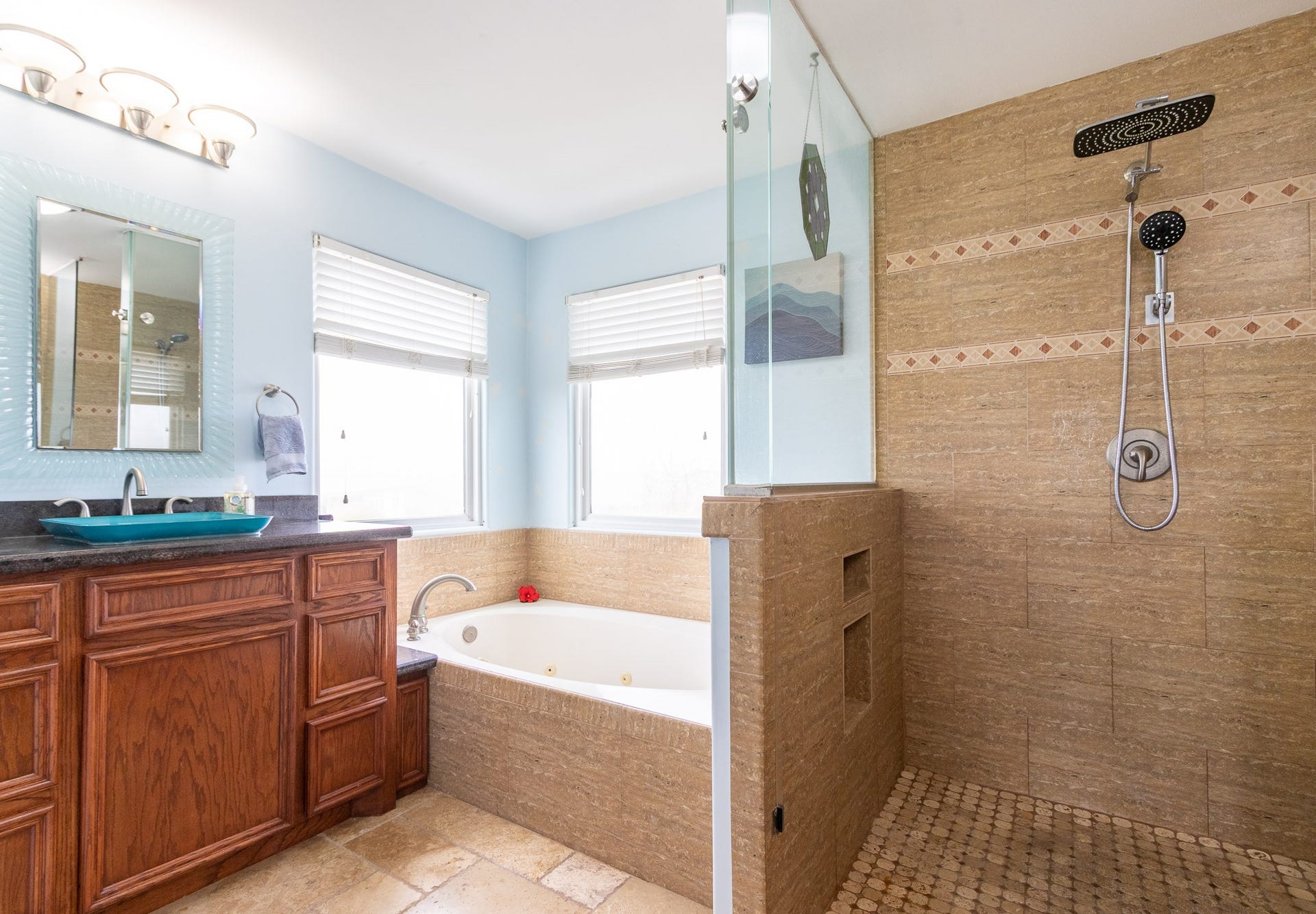 2414 Avenue P, San Leon, TX 77539 Primary ensuite bathroom with dual shower heads. and jetted spa tub. Glass vessel sinks.