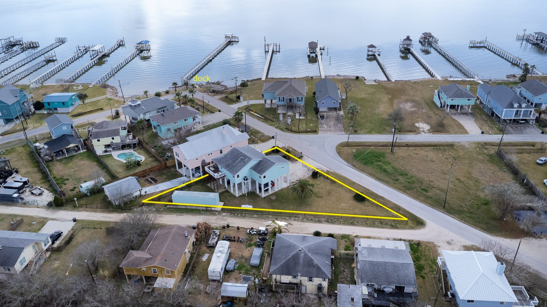 2414 Avenue P, San Leon, TX 77539 Pie shaped corner lot with private bay access from the pier that only 5 properties share.