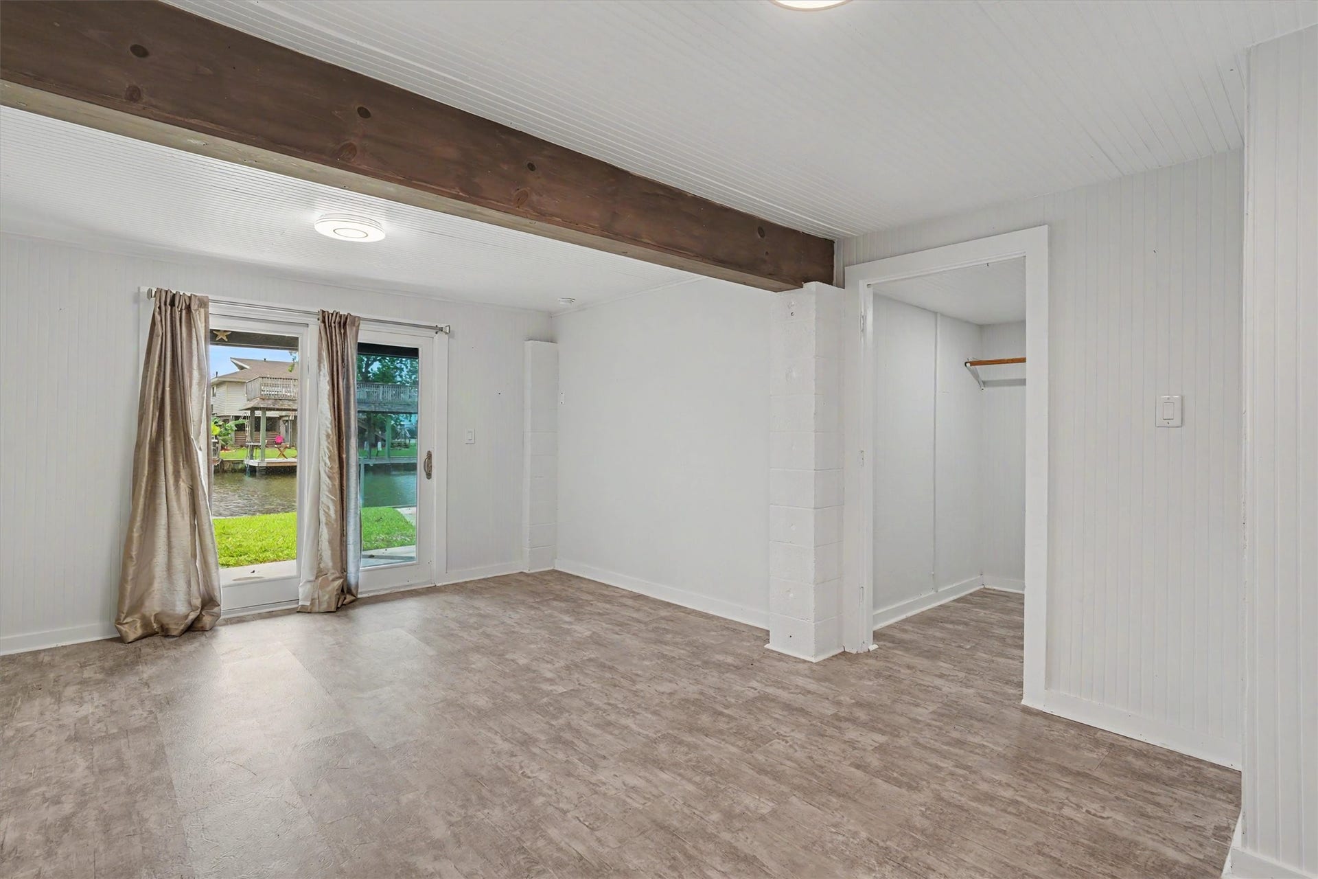 370 Ling Street, Bayou Vista, TX 77563 This bedroom/flex room has a very large walk in closet. The natural colored wood beam is a nice touch