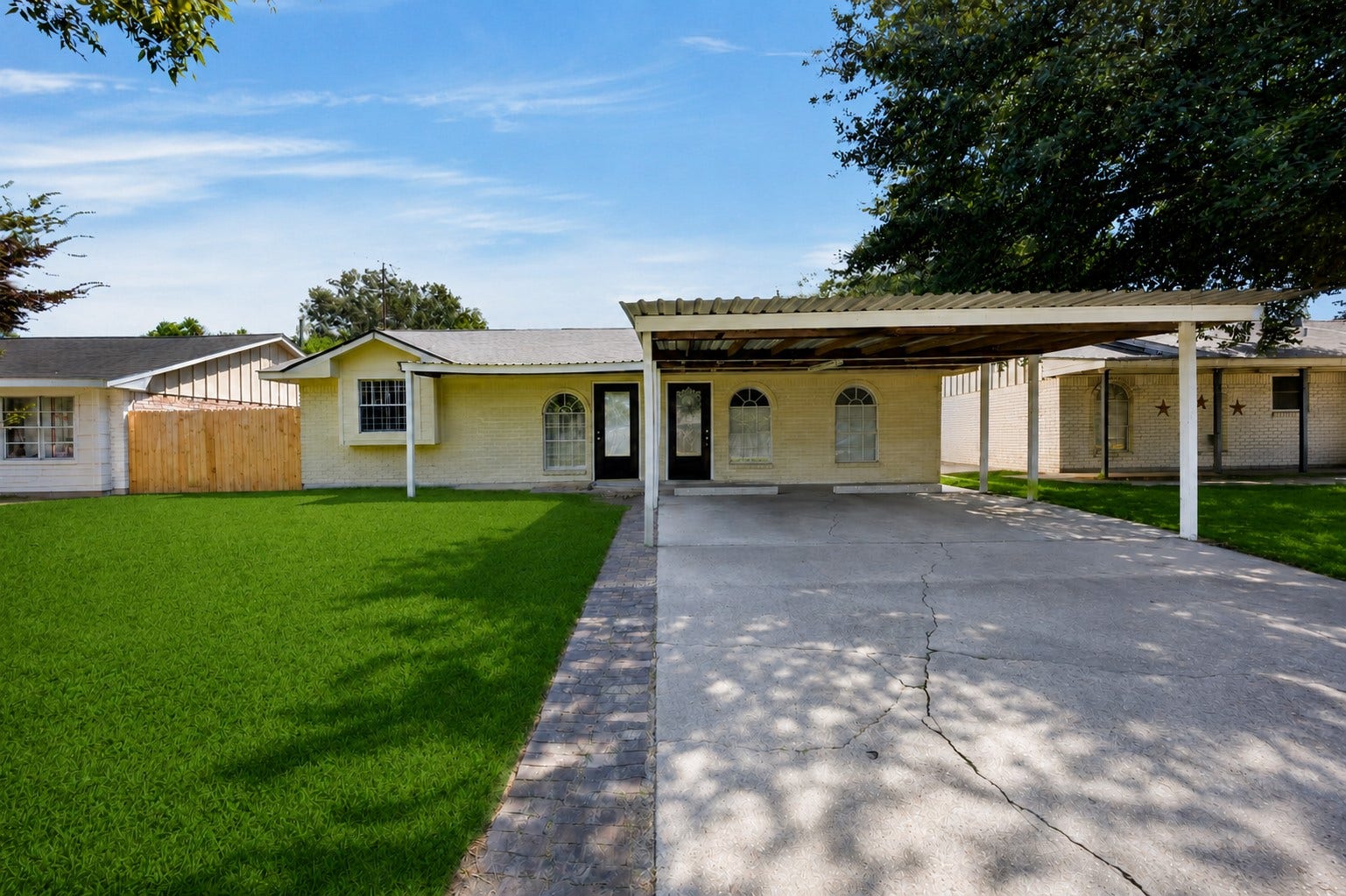 522 Hollyvale Dr, Houston, TX 77060 Classic front elevation with a welcoming walkway and mature landscaping.